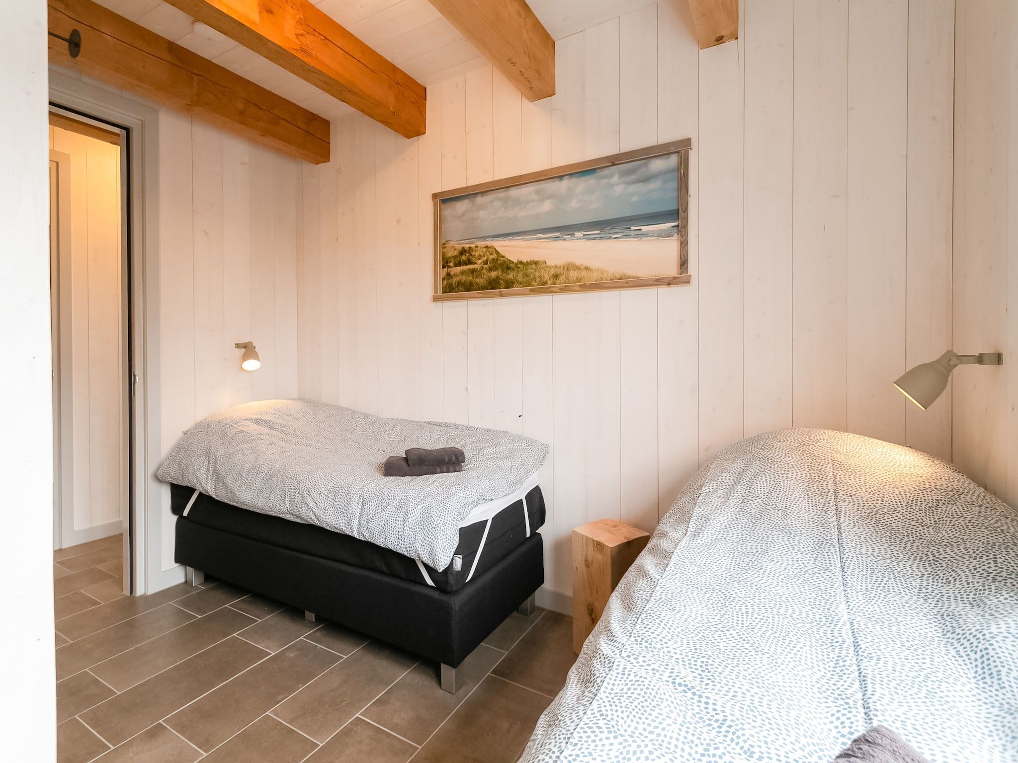 Een slaapkamer van Hazenborgh - Duinhuis 1 in Callantsoog