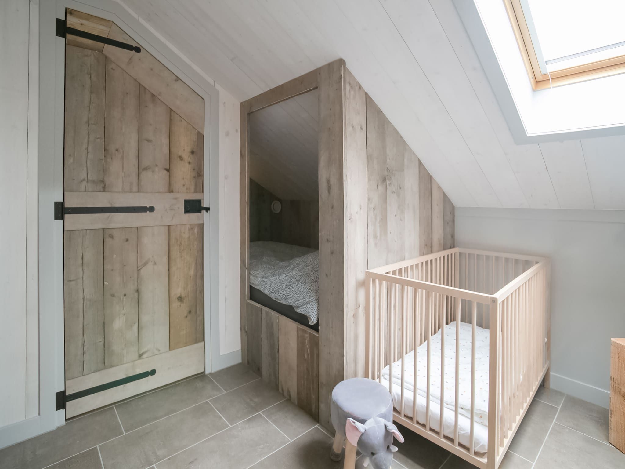 Een slaapkamer van Hazenborgh - Duinhuis 1 in Callantsoog