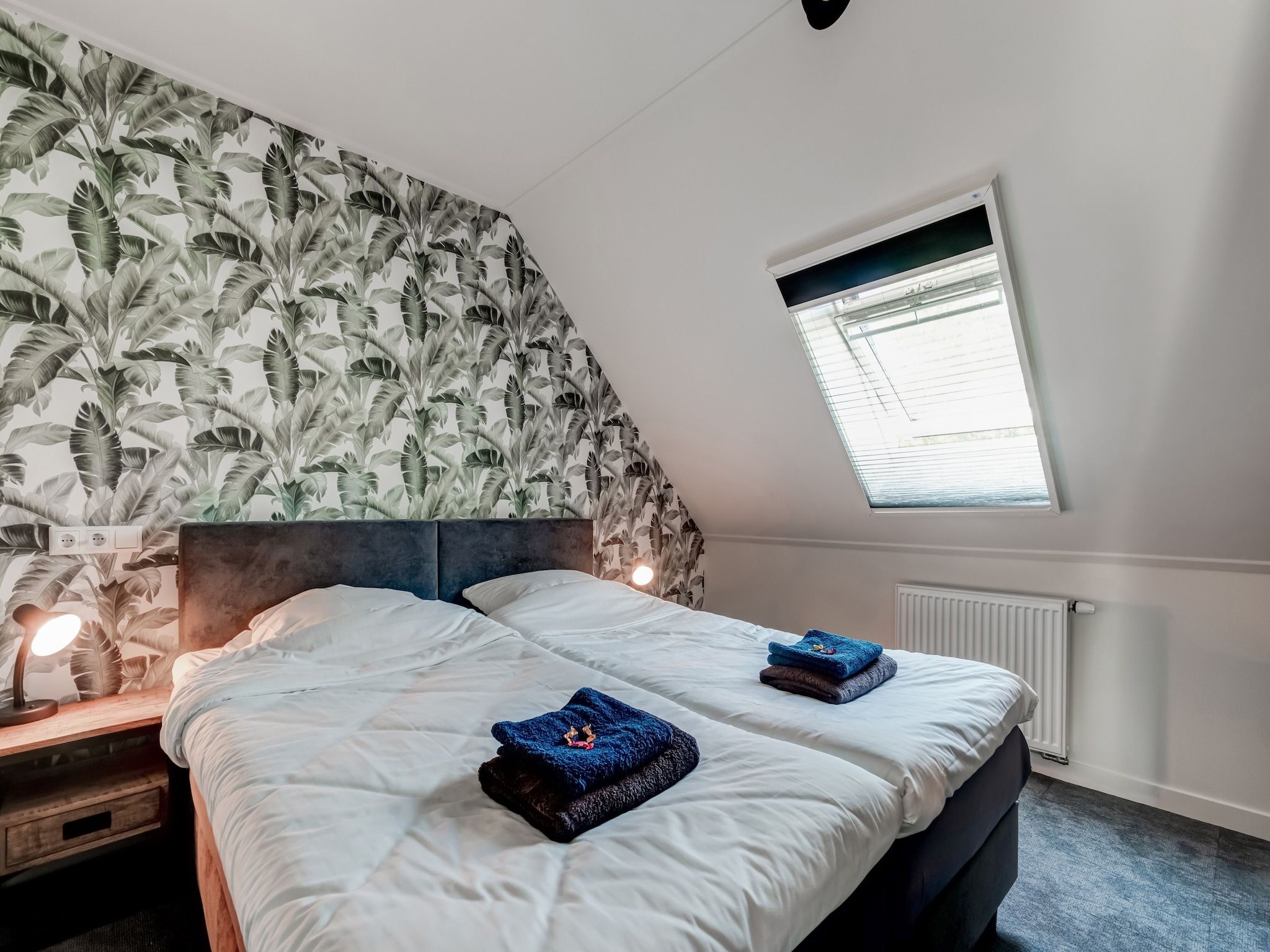 Een slaapkamer van Boerderij Koatstertille in Friesland