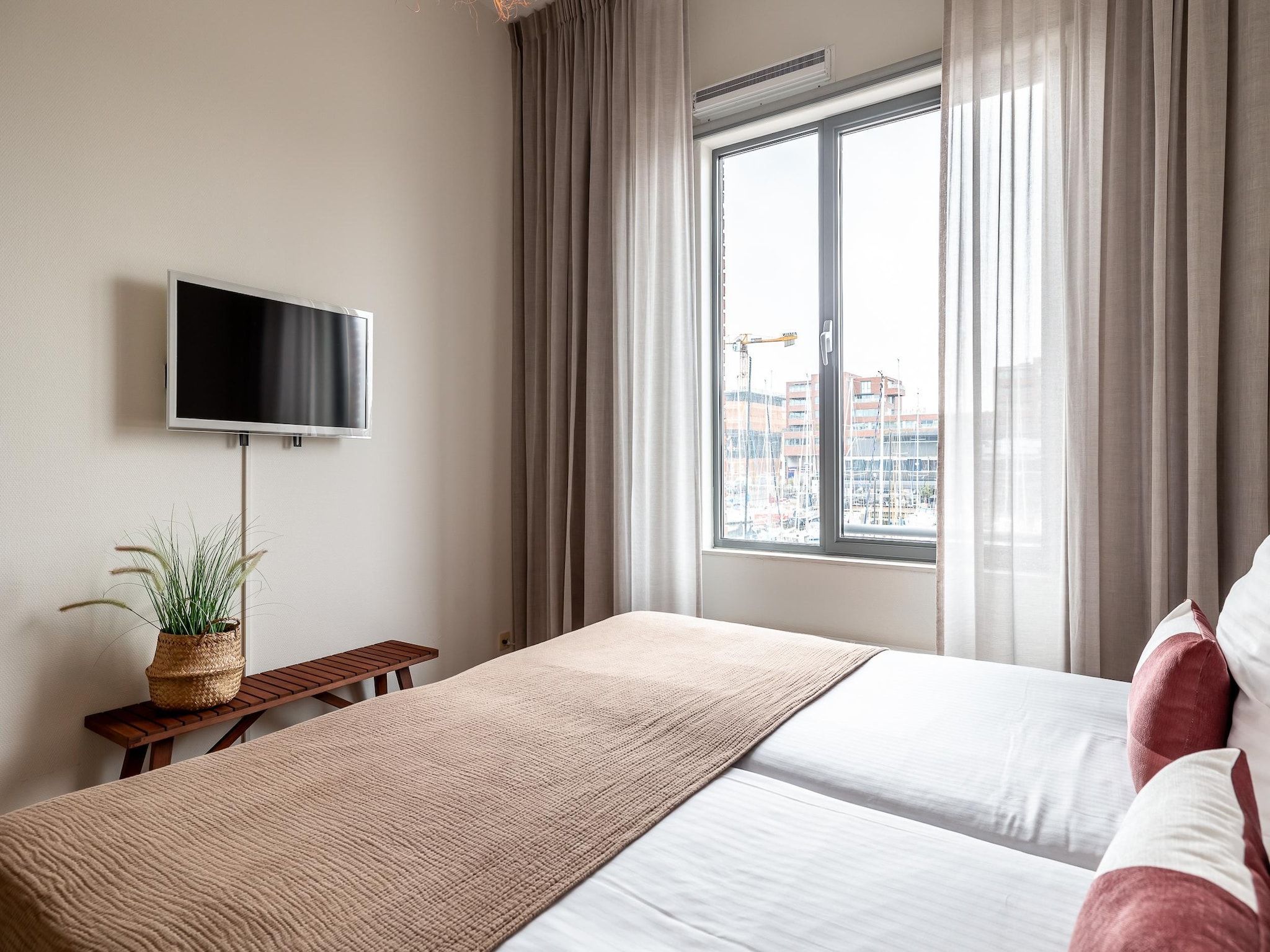 Een slaapkamer van Scheveningen Harbour 56 in Den Haag