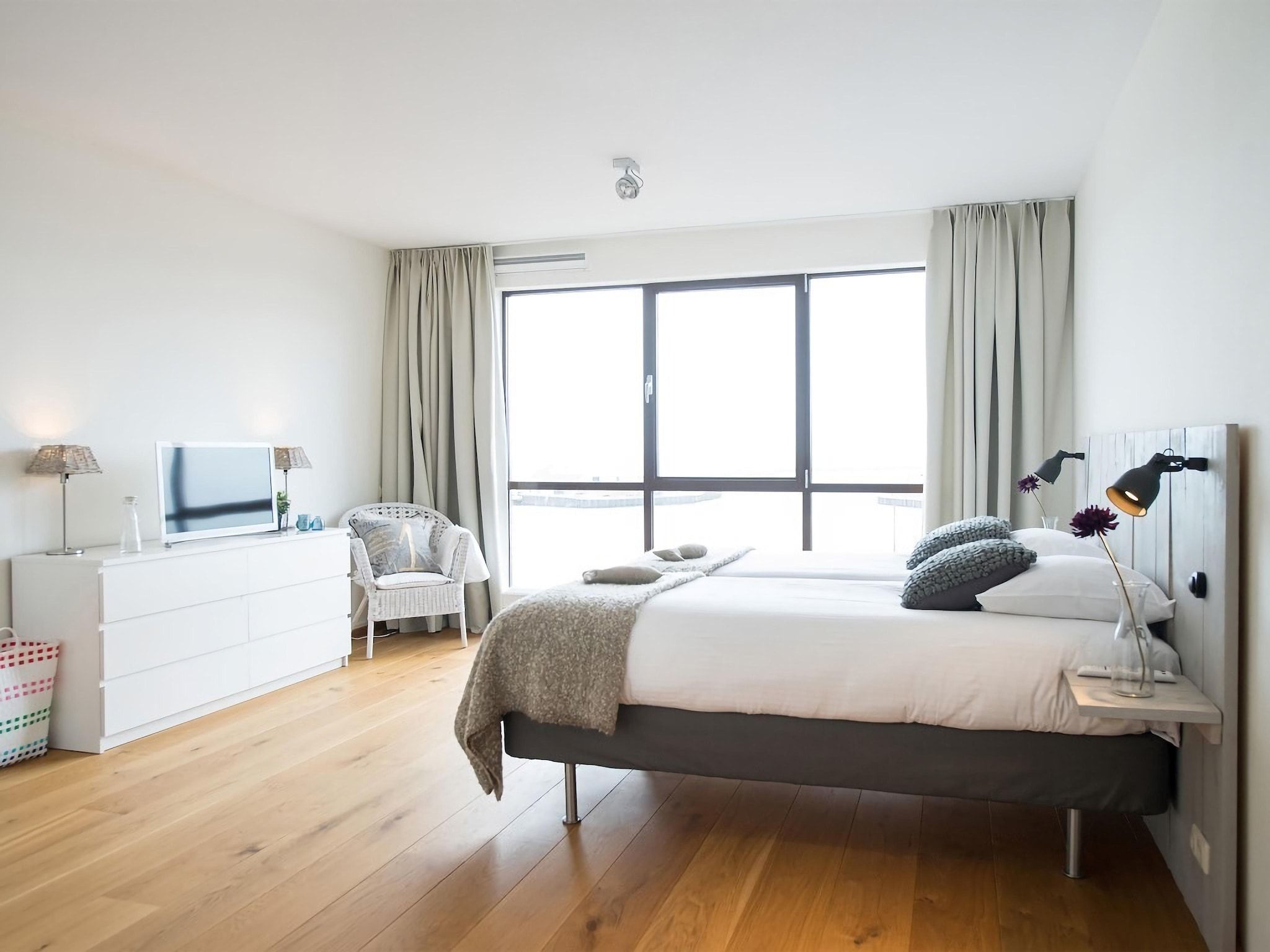 Een slaapkamer van Scheveningen Harbour 32 in Den Haag