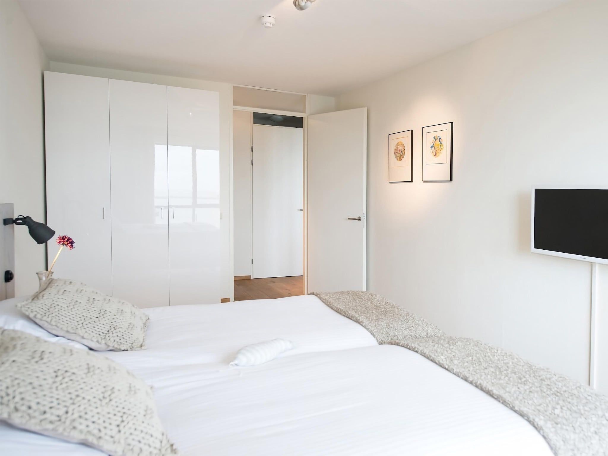 Een slaapkamer van Scheveningen Harbour 32 in Den Haag