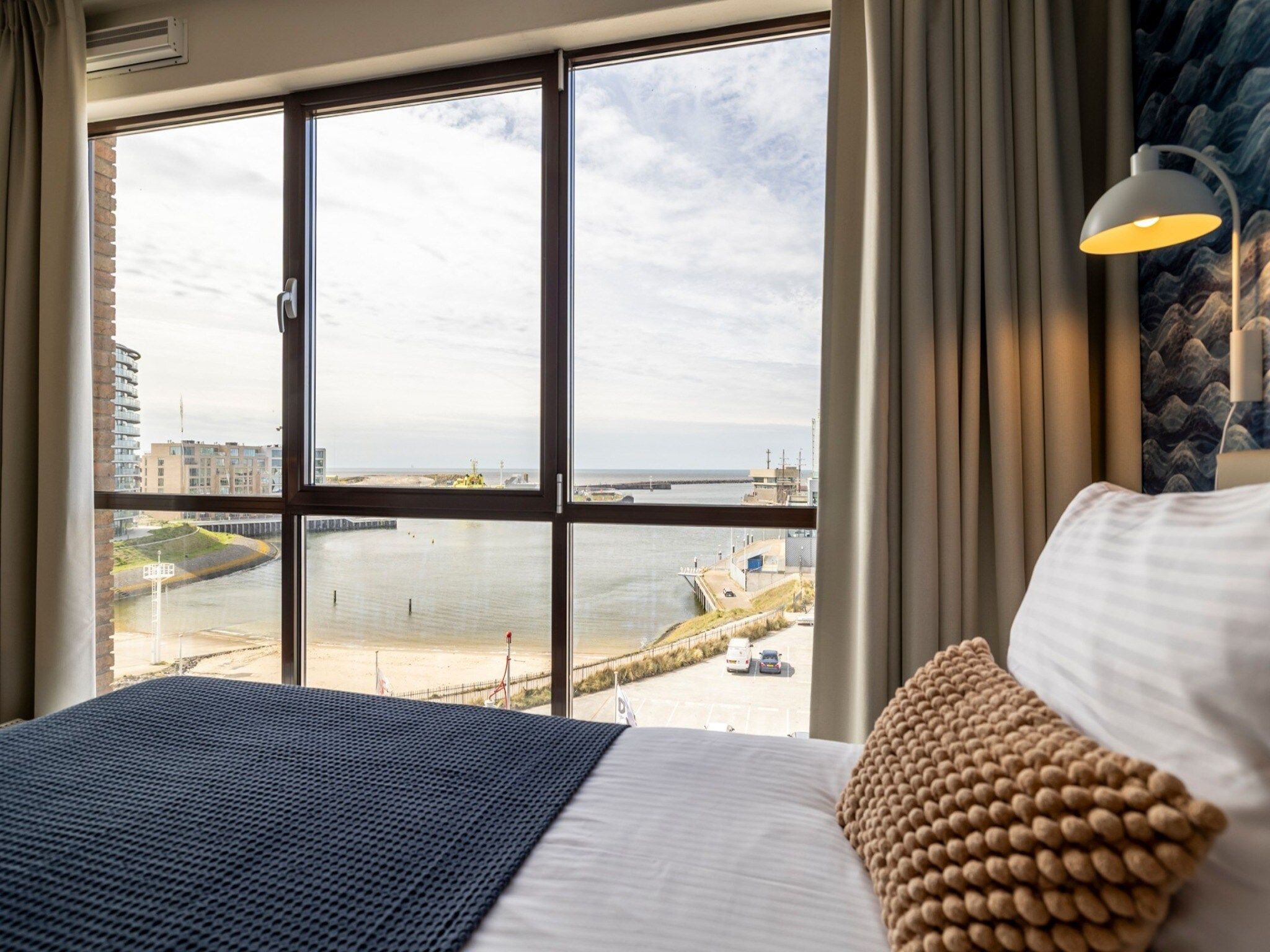 Een slaapkamer van Scheveningen Harbour 32 in Den Haag