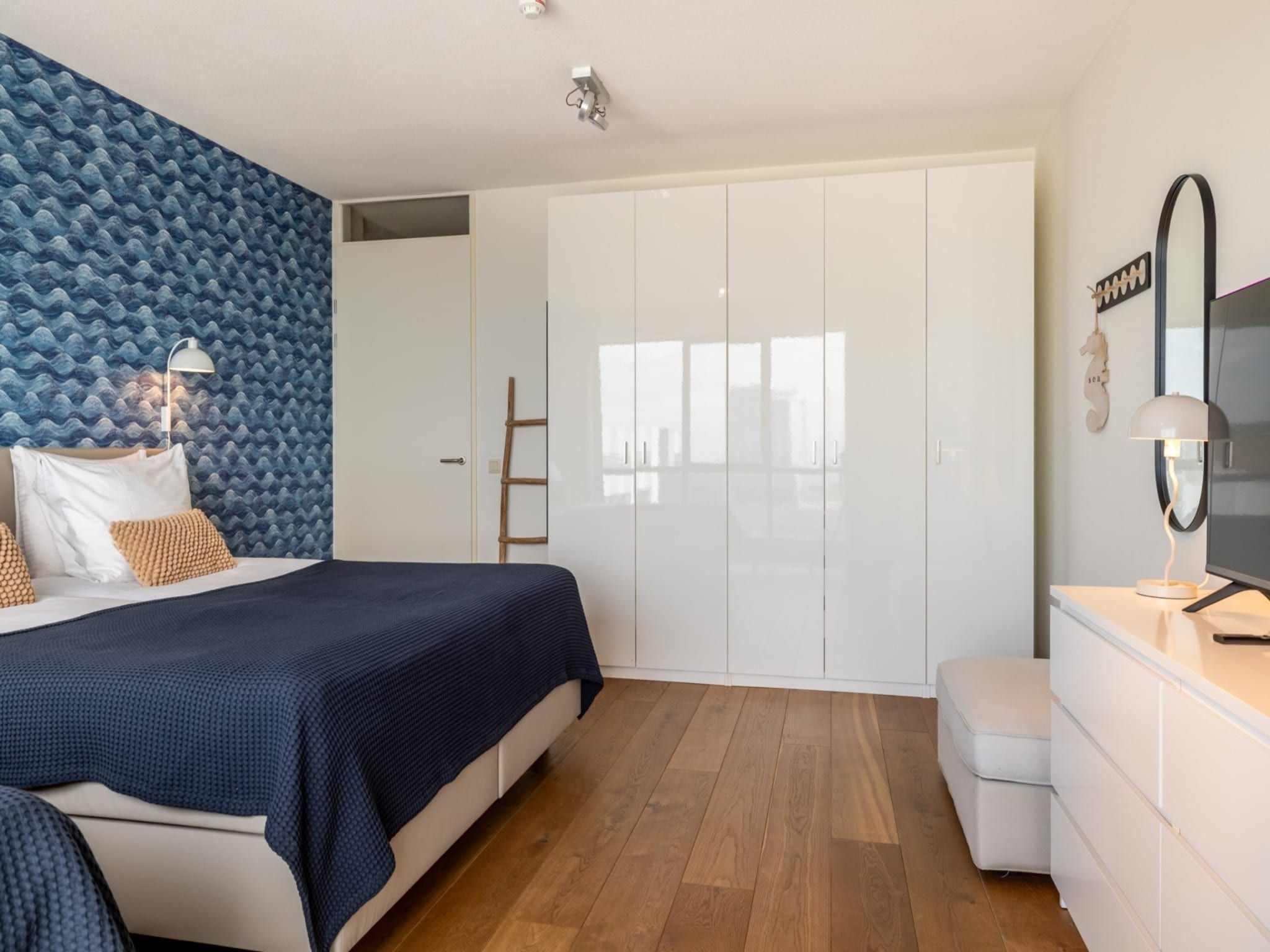 Een slaapkamer van Scheveningen Harbour 32 in Den Haag