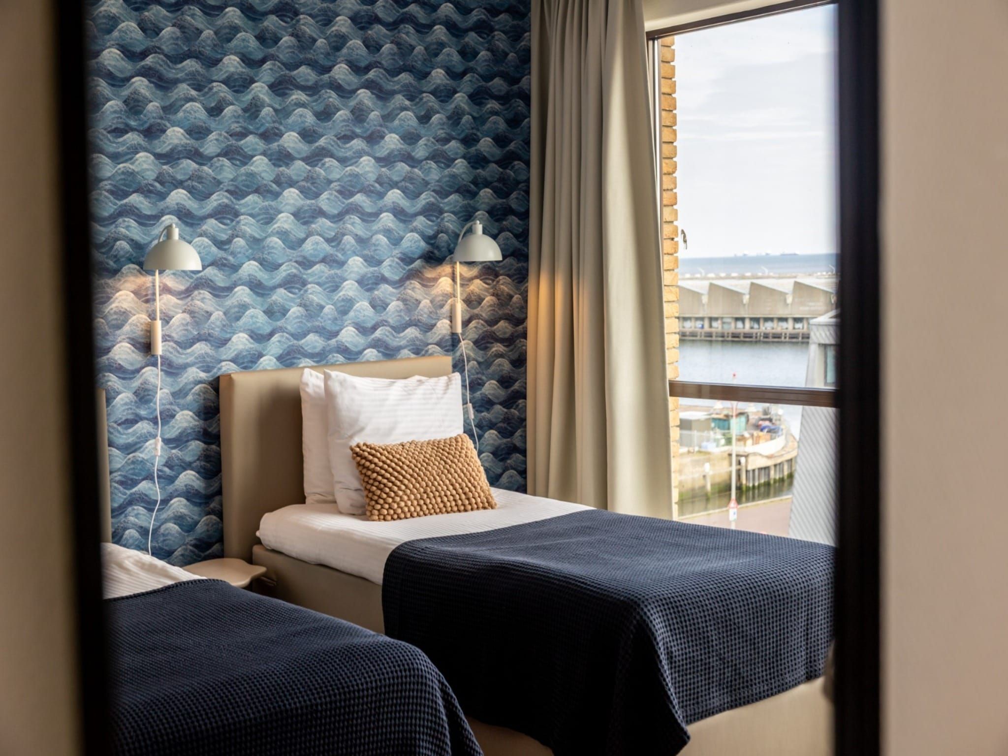 Een slaapkamer van Scheveningen Harbour 32 in Den Haag