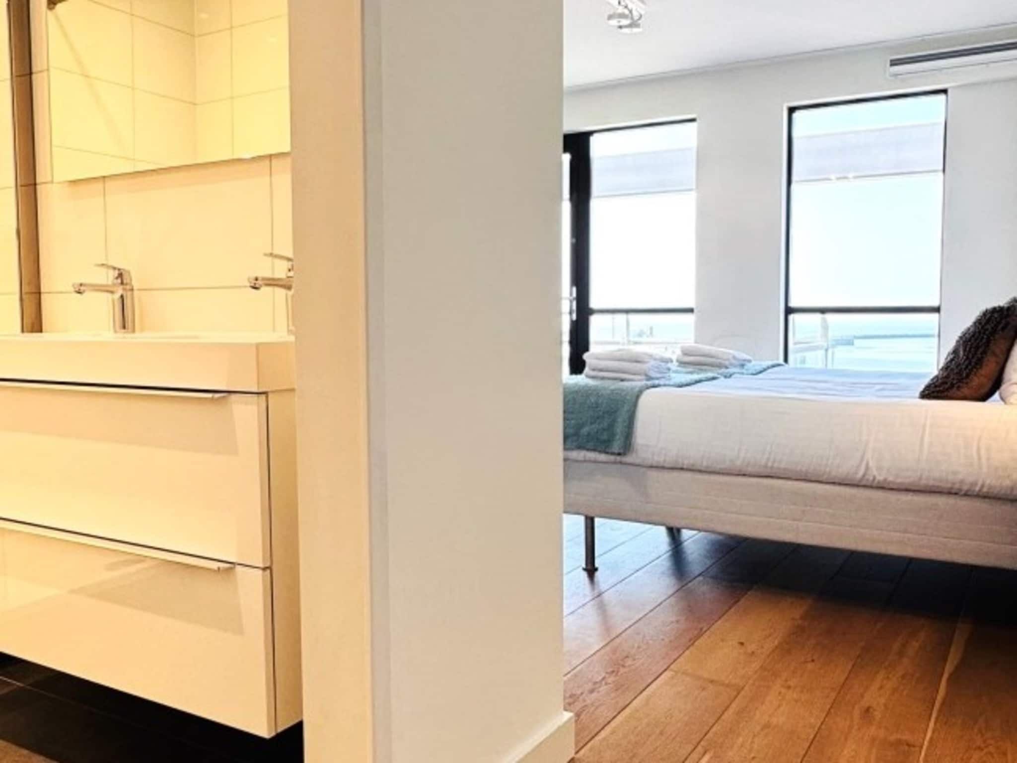 Een slaapkamer van Scheveningen Harbour 32C in Den Haag