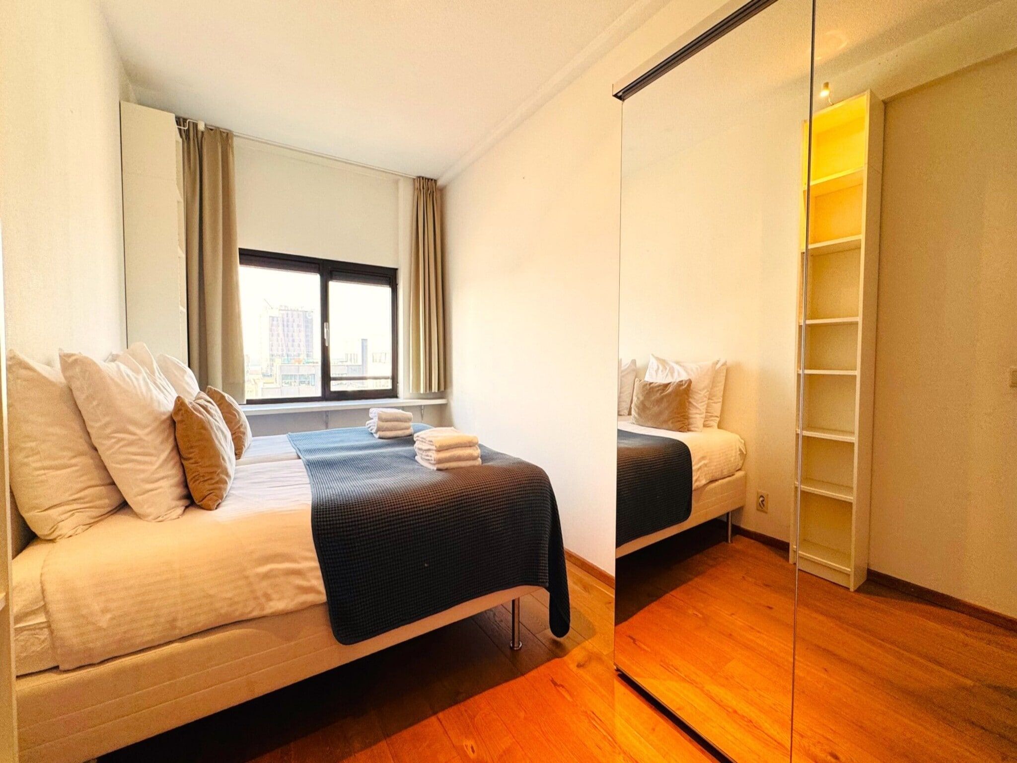 Een slaapkamer van Scheveningen Harbour 32C in Den Haag