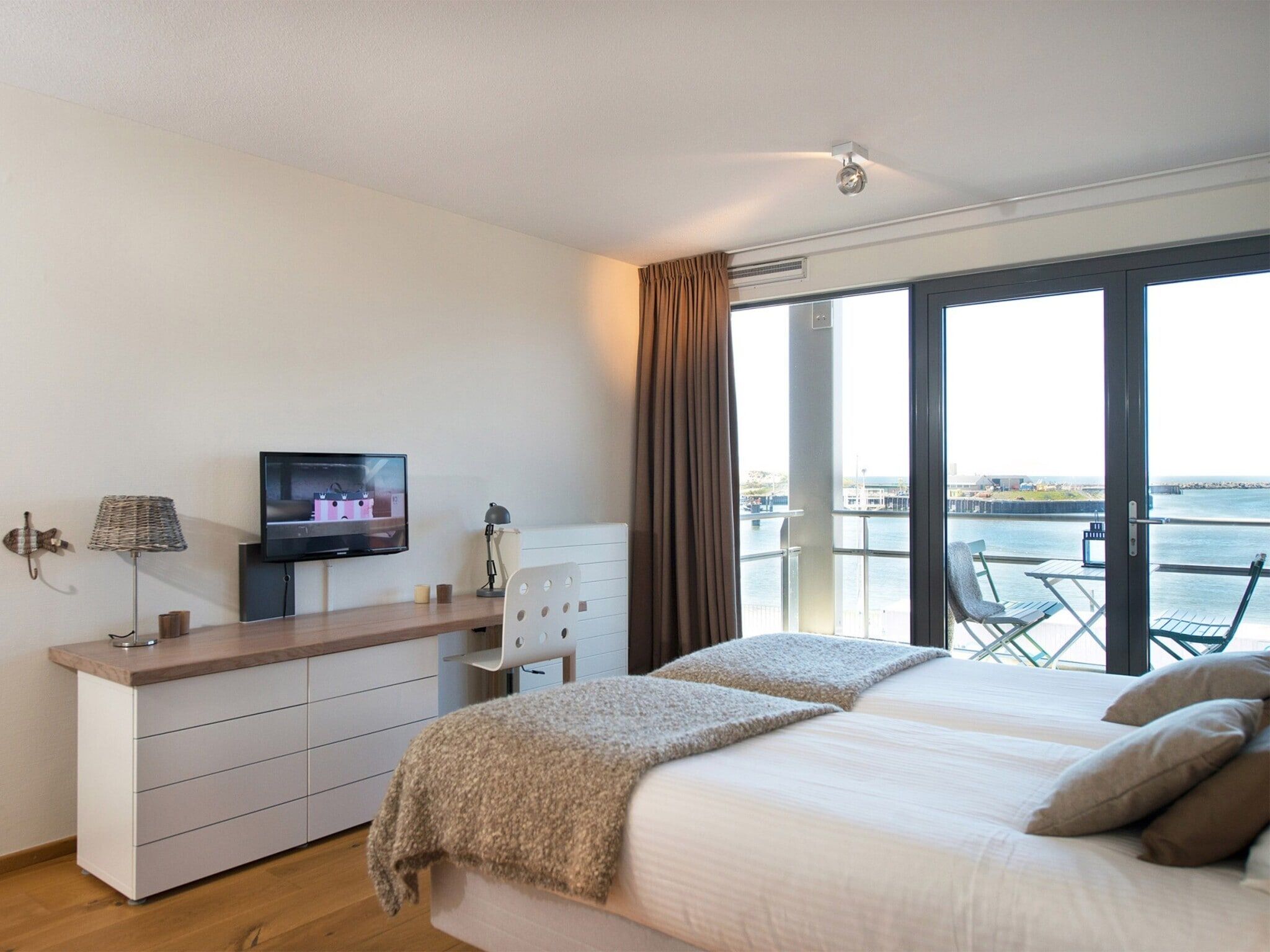 Een slaapkamer van Scheveningen Harbour 36 in Den Haag