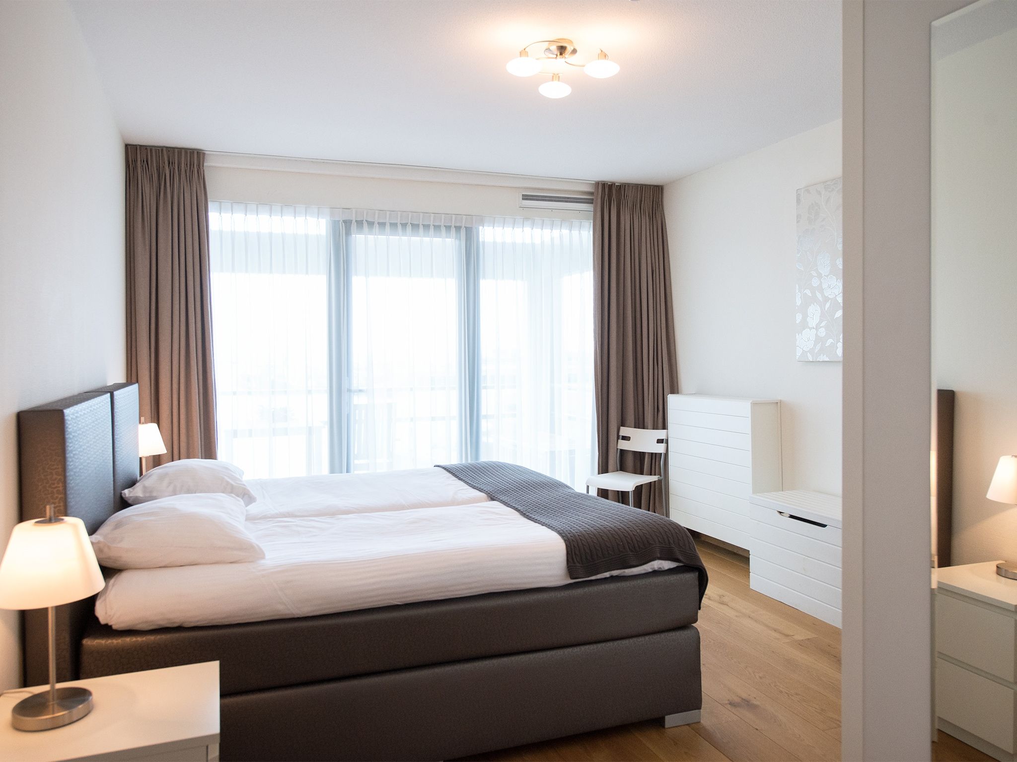 Een slaapkamer van Scheveningen Harbour 40 in Den Haag