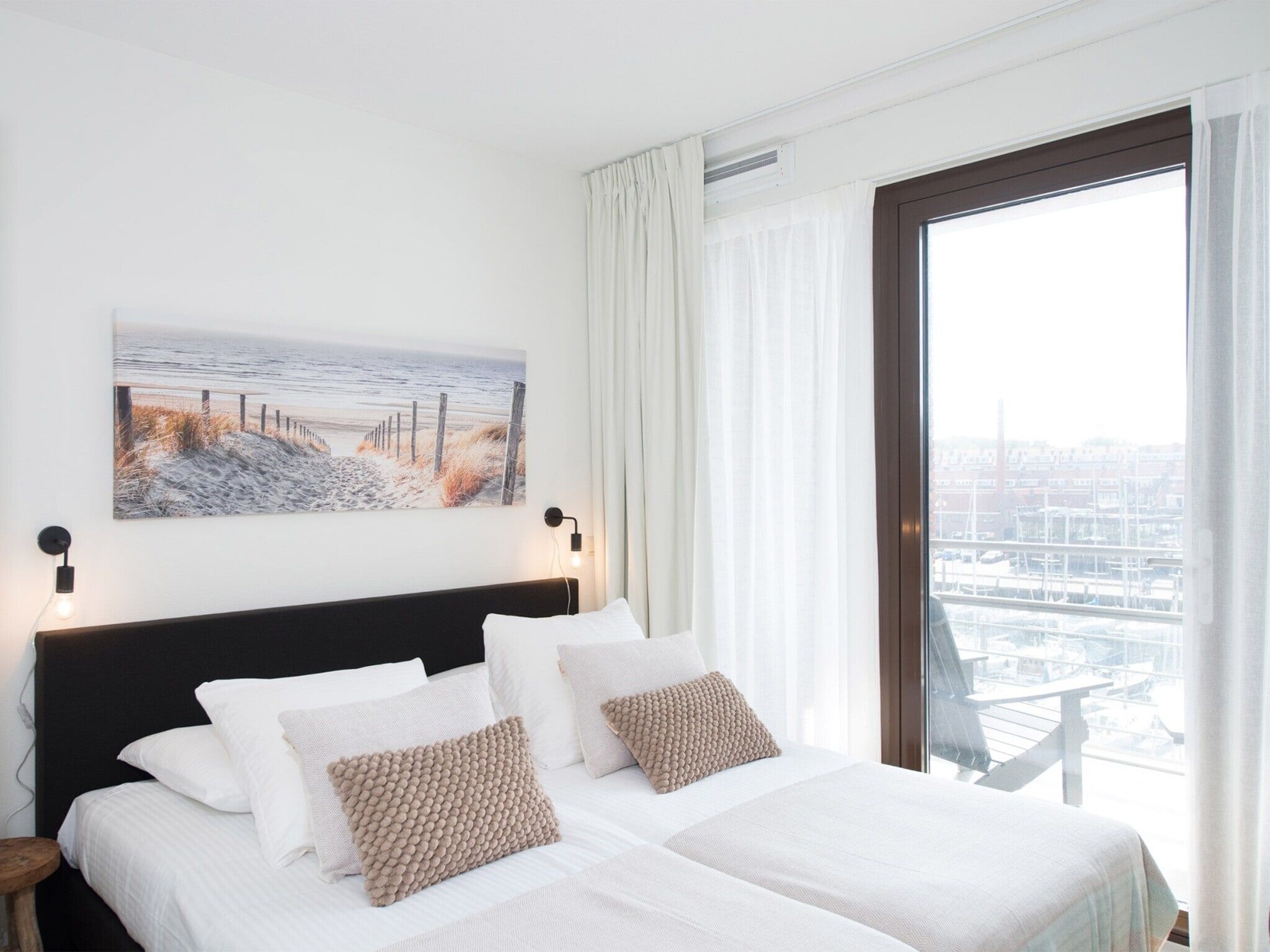 Een slaapkamer van Scheveningen Harbour 48A in Den Haag