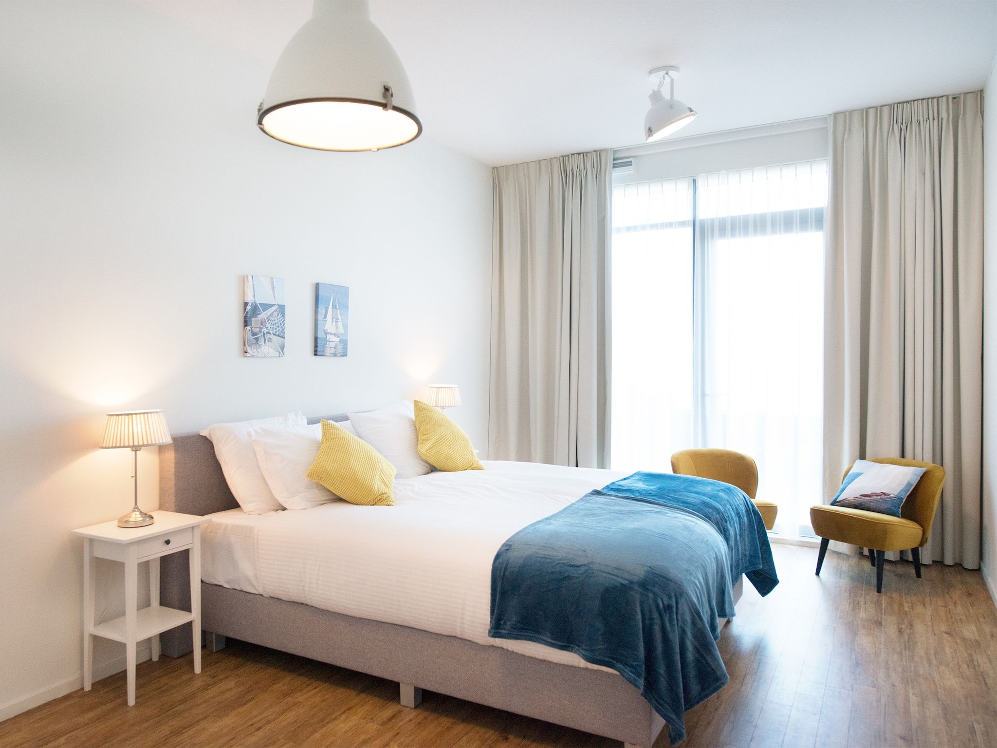 Een slaapkamer van Scheveningen Harbour 56D in Den Haag