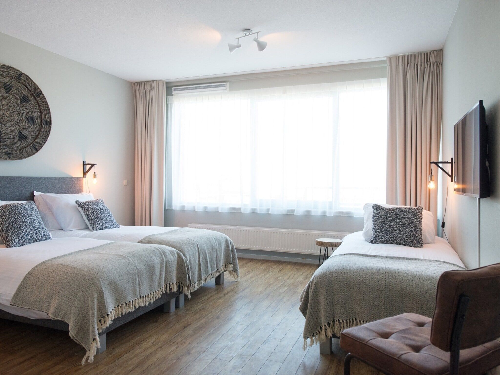 Een slaapkamer van Scheveningen Harbour 58 in Den Haag