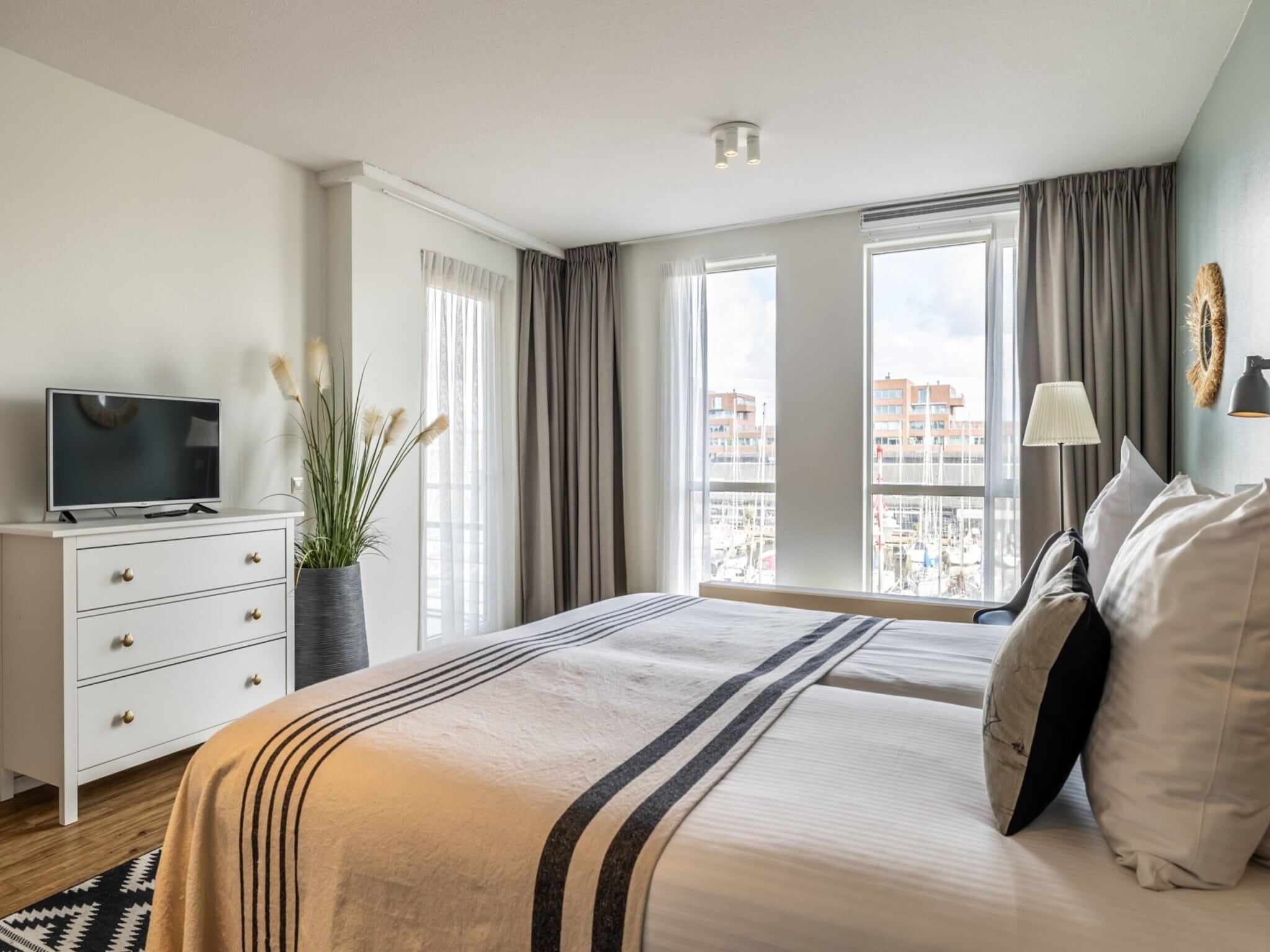 Een slaapkamer van Scheveningen Harbour 60B in Den Haag