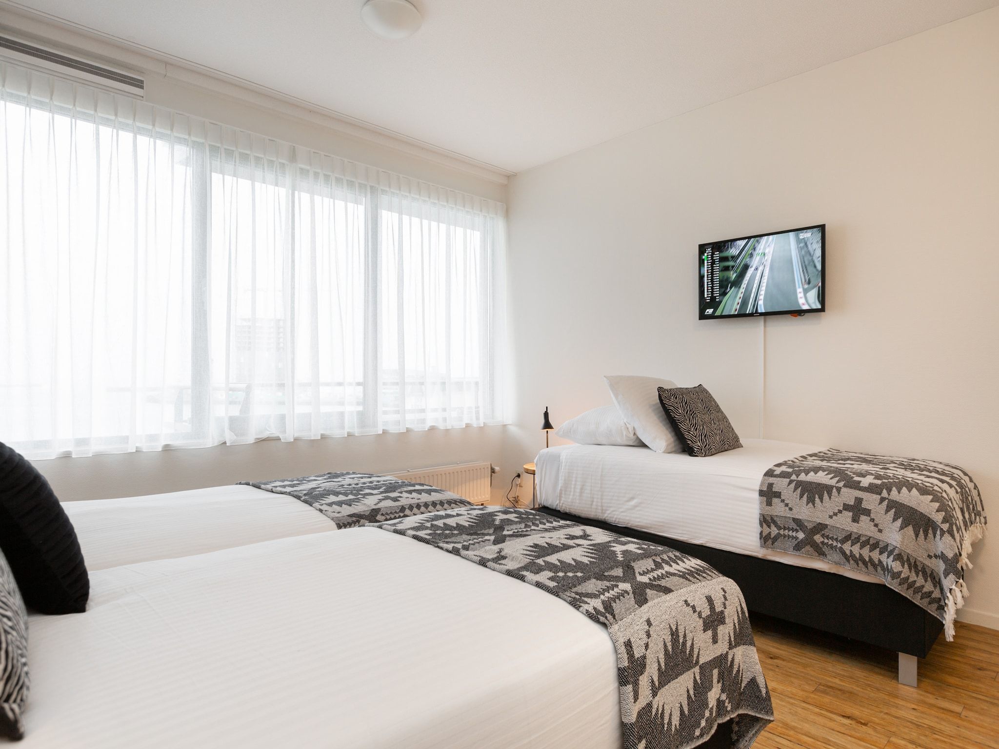 Een slaapkamer van Scheveningen Harbour 62 in Den Haag