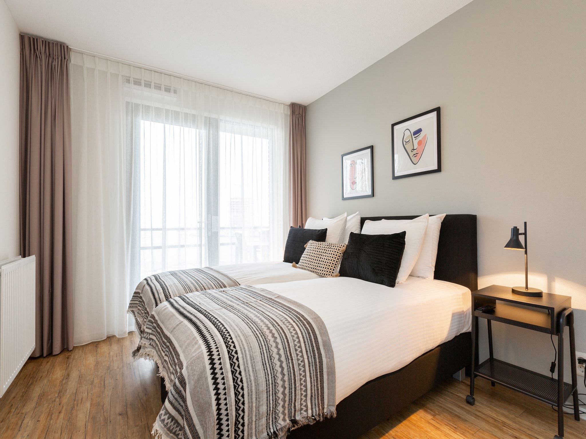 Een slaapkamer van Scheveningen Harbour 62 in Den Haag