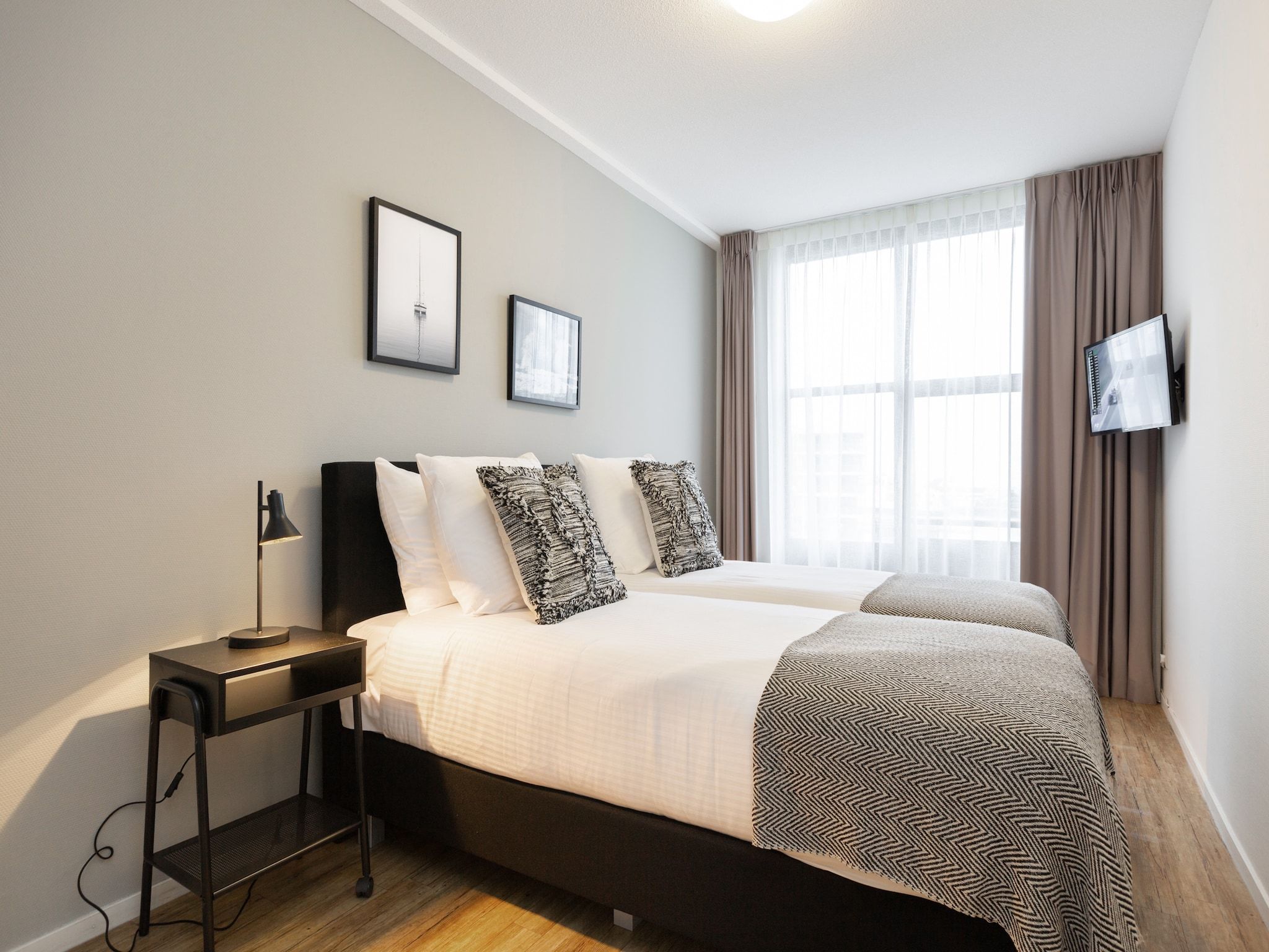 Een slaapkamer van Scheveningen Harbour 62 in Den Haag