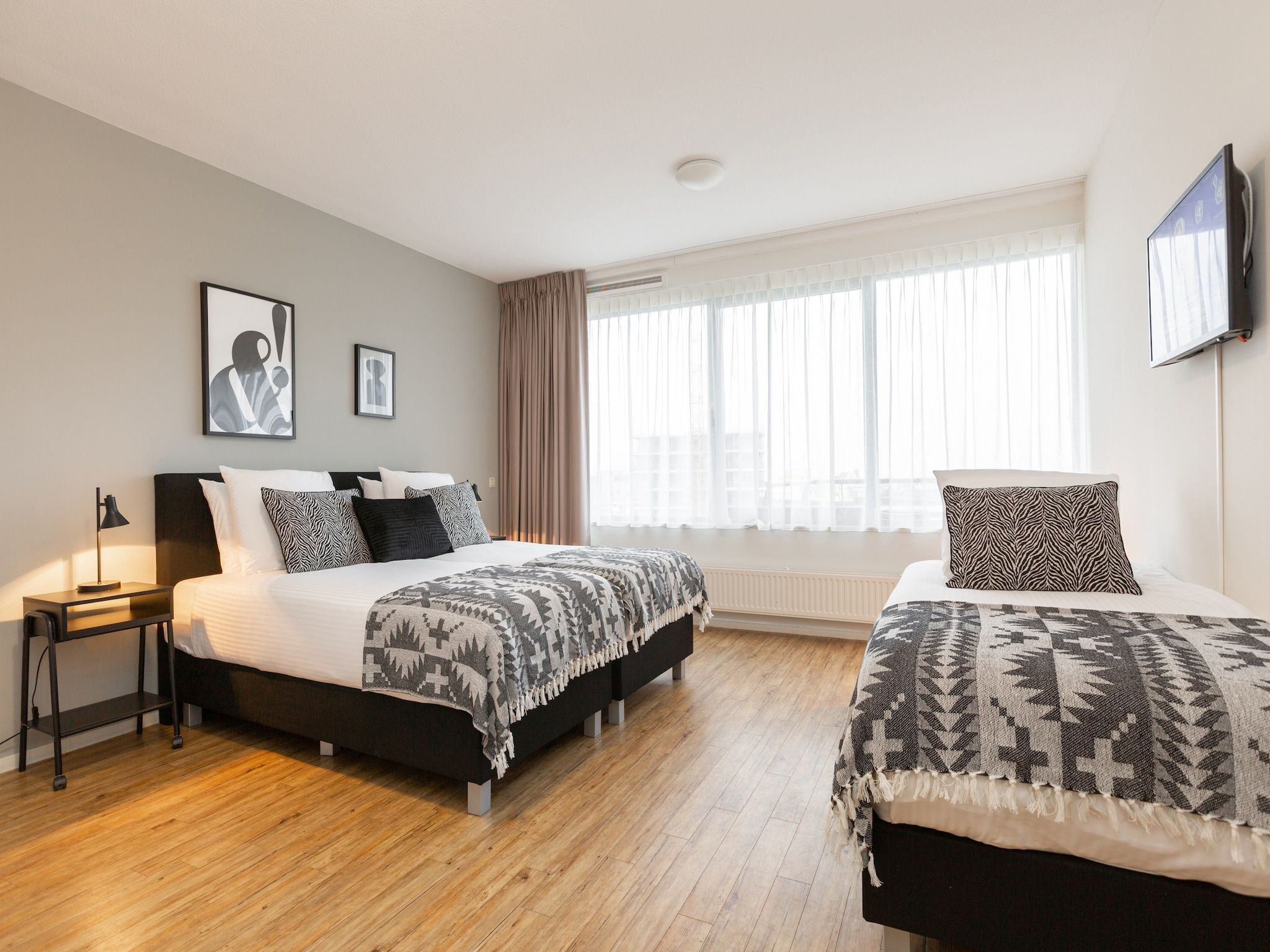 Een slaapkamer van Scheveningen Harbour 62 in Den Haag