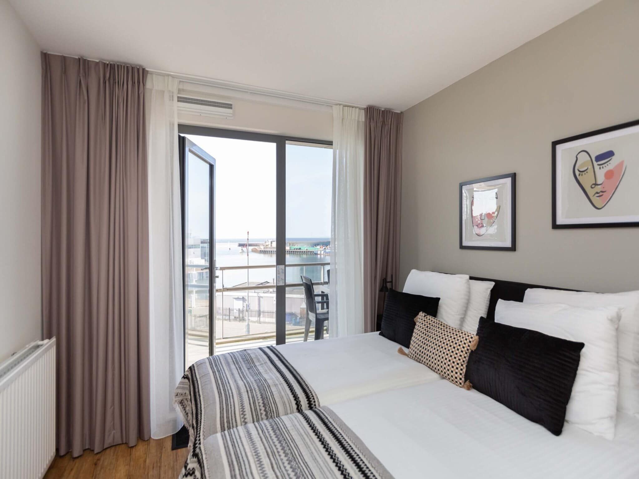 Een slaapkamer van Scheveningen Harbour 62 in Den Haag