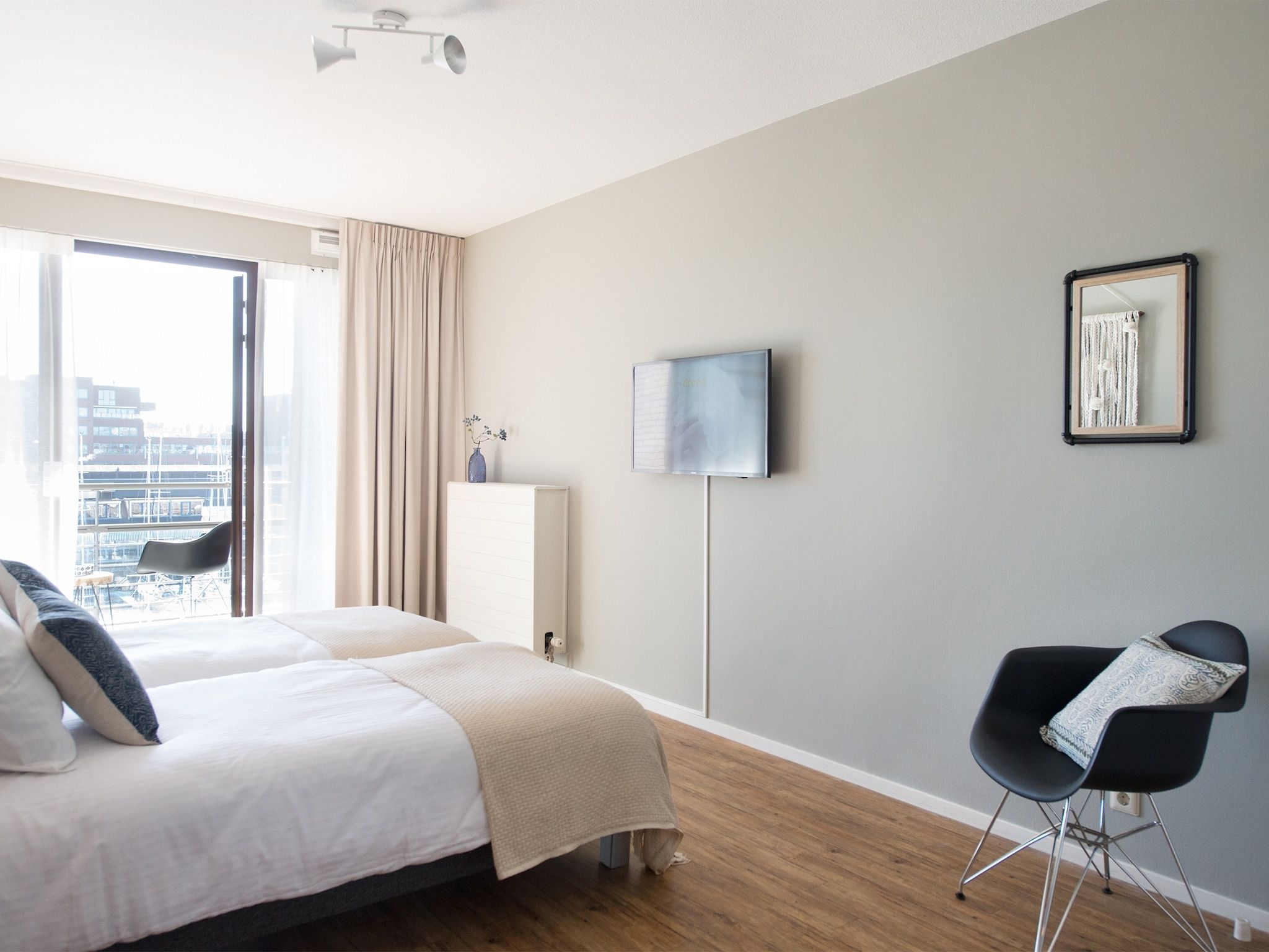Een slaapkamer van Scheveningen Harbour 62A in Den Haag