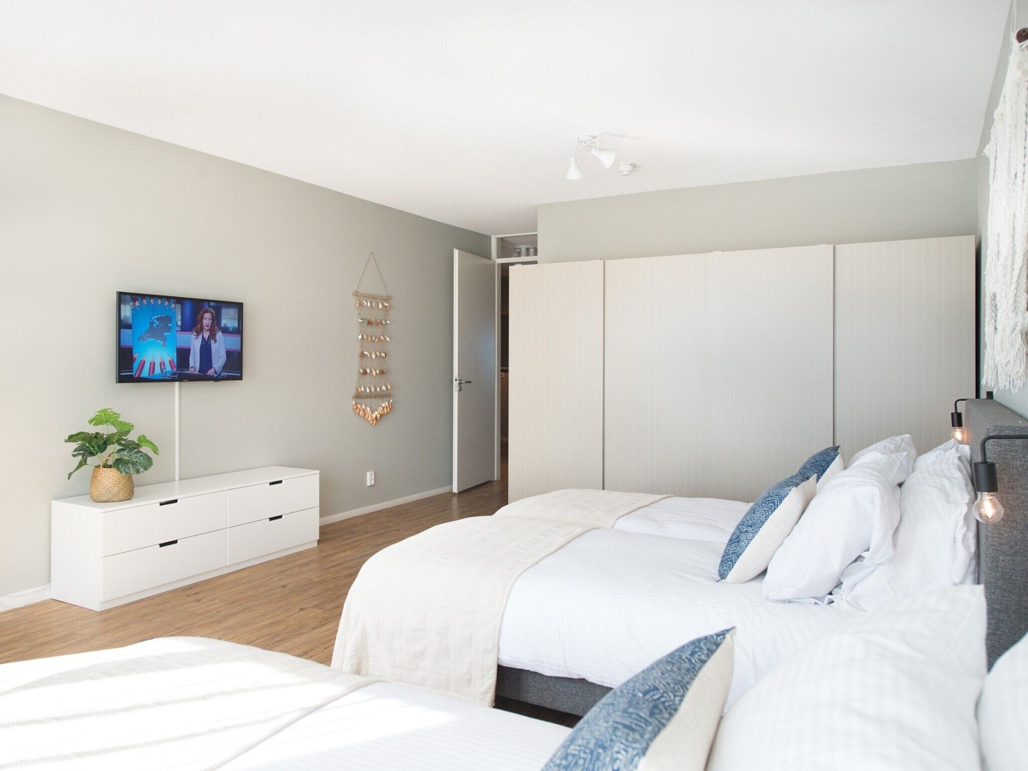 Een slaapkamer van Scheveningen Harbour 62A in Den Haag