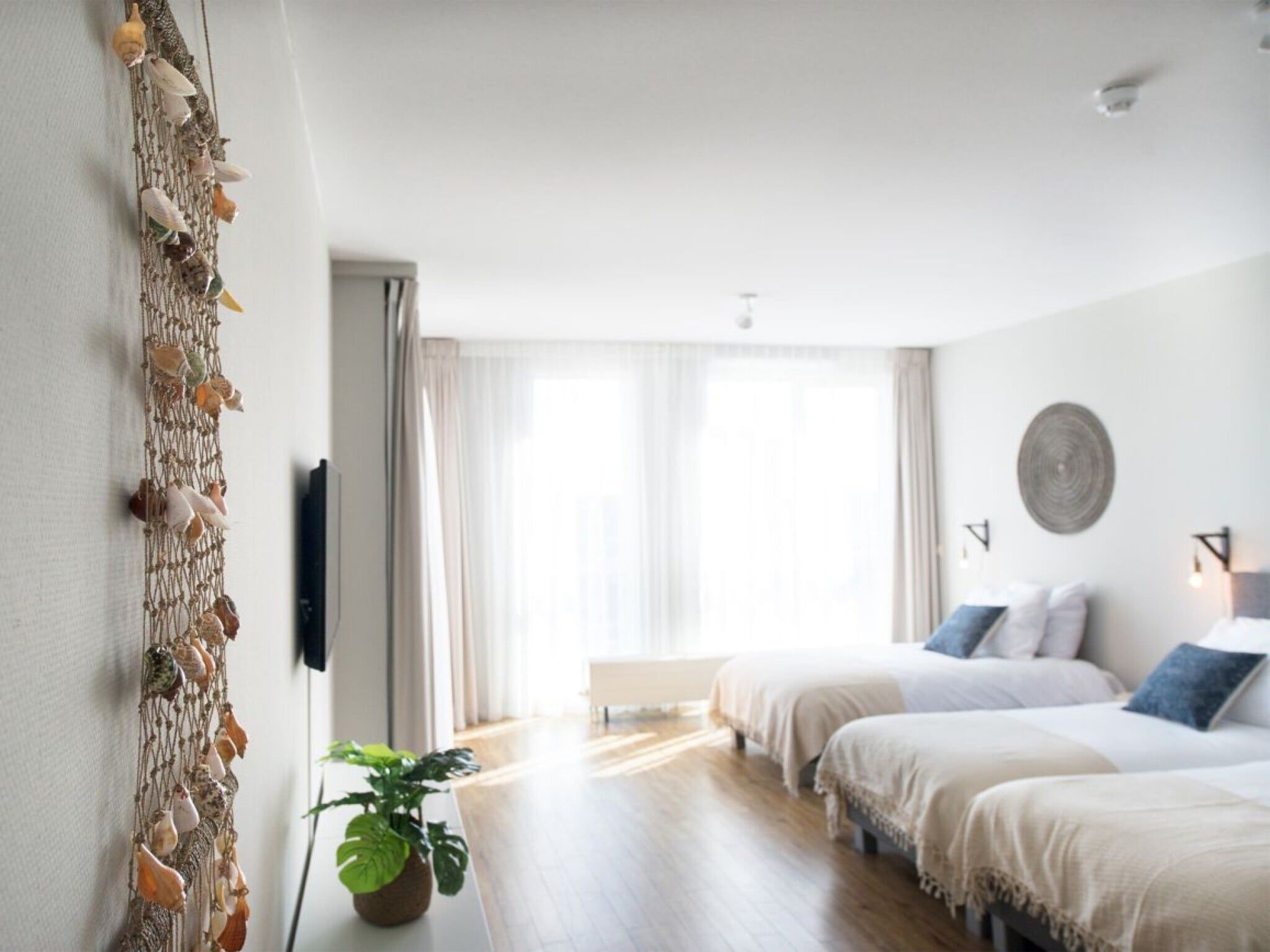 Een slaapkamer van Scheveningen Harbour 68B in Den Haag