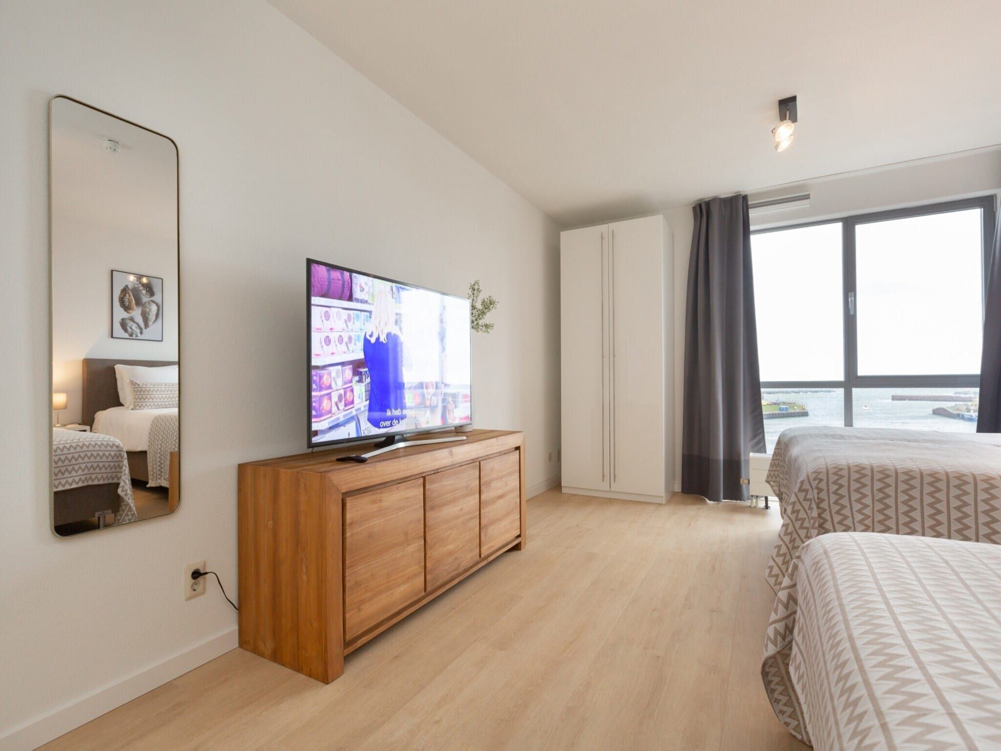 Een slaapkamer van Scheveningen Harbour 72A in Den Haag