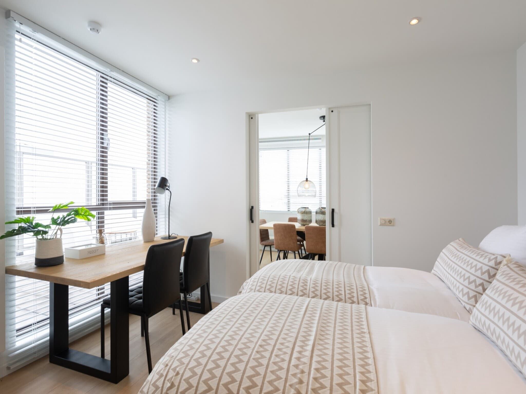 Een slaapkamer van Scheveningen Harbour 72A in Den Haag