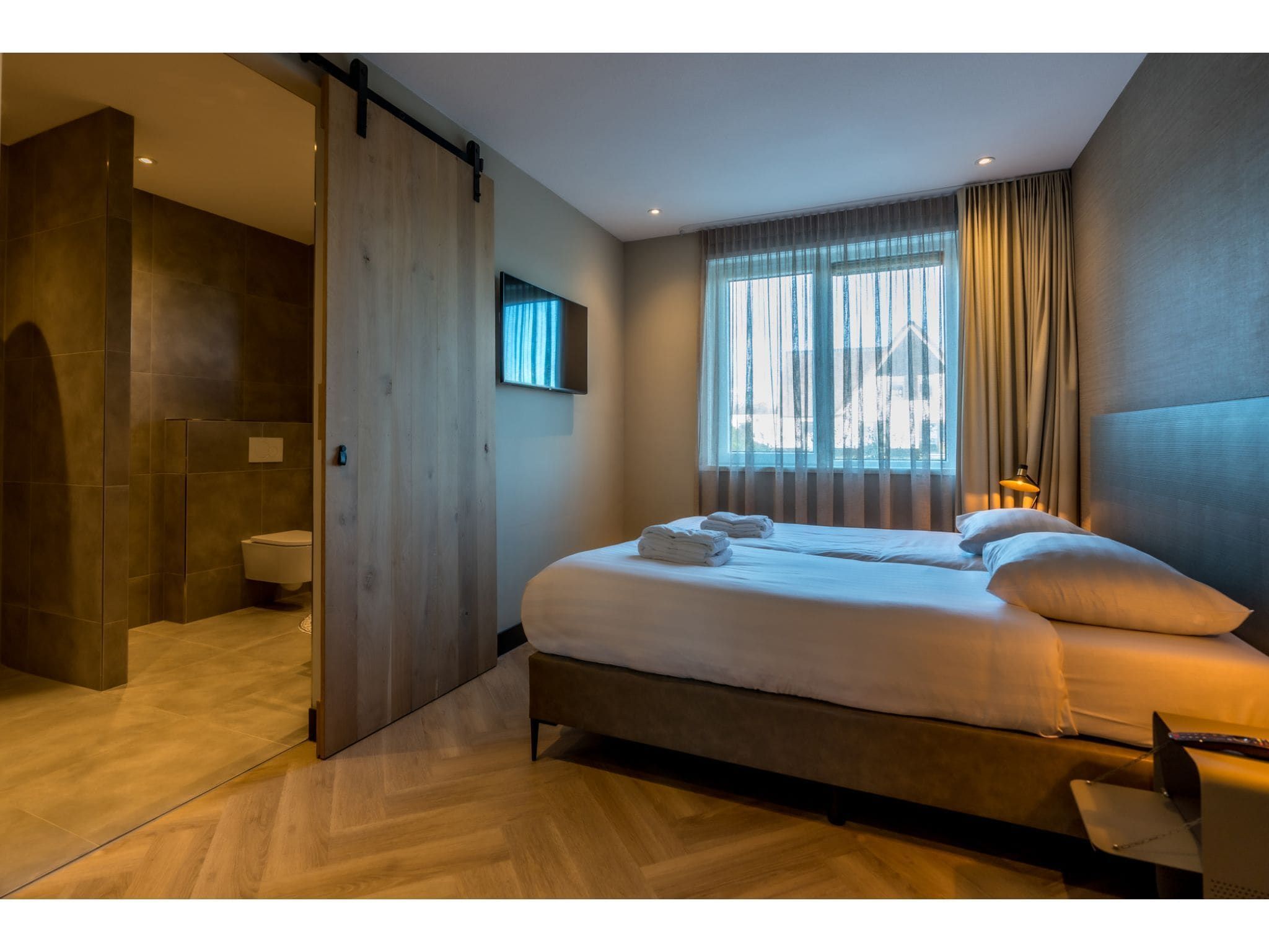 Een slaapkamer van O-Princenhof A 8 persoons in De Cocksdorp