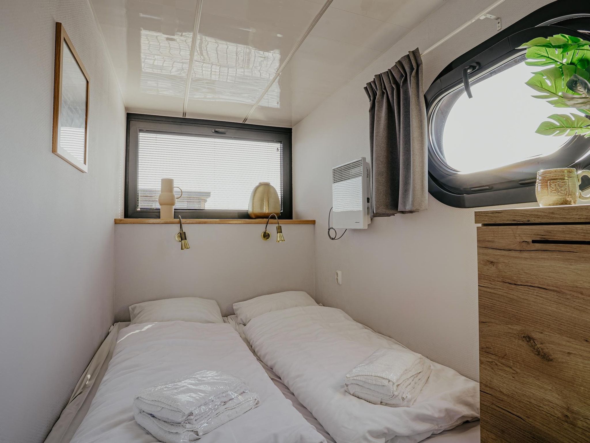 Een slaapkamer van Waterpark de Meerparel 10 in Uitgeest