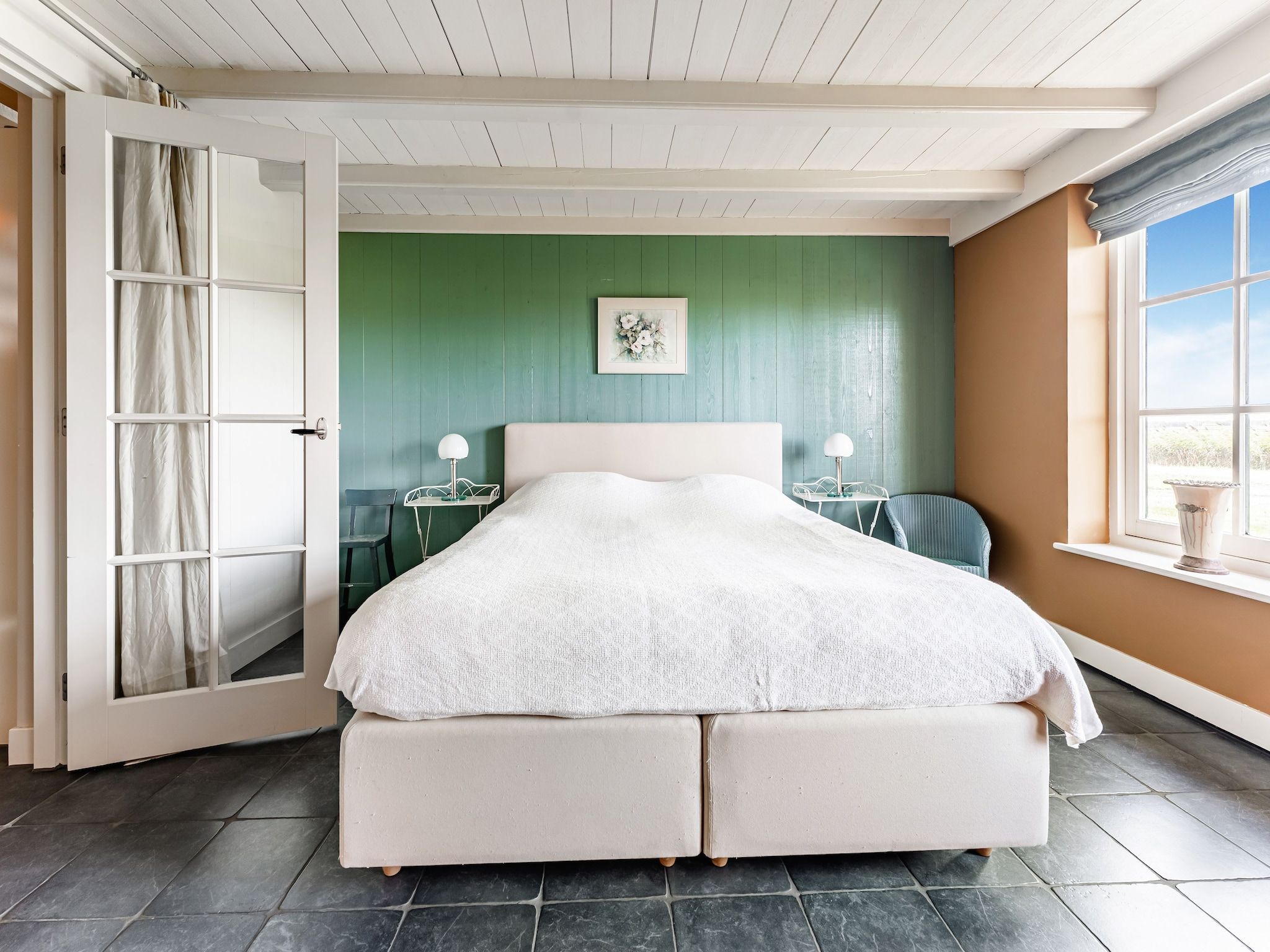 Een slaapkamer van De Pauwenhof in Heiloo