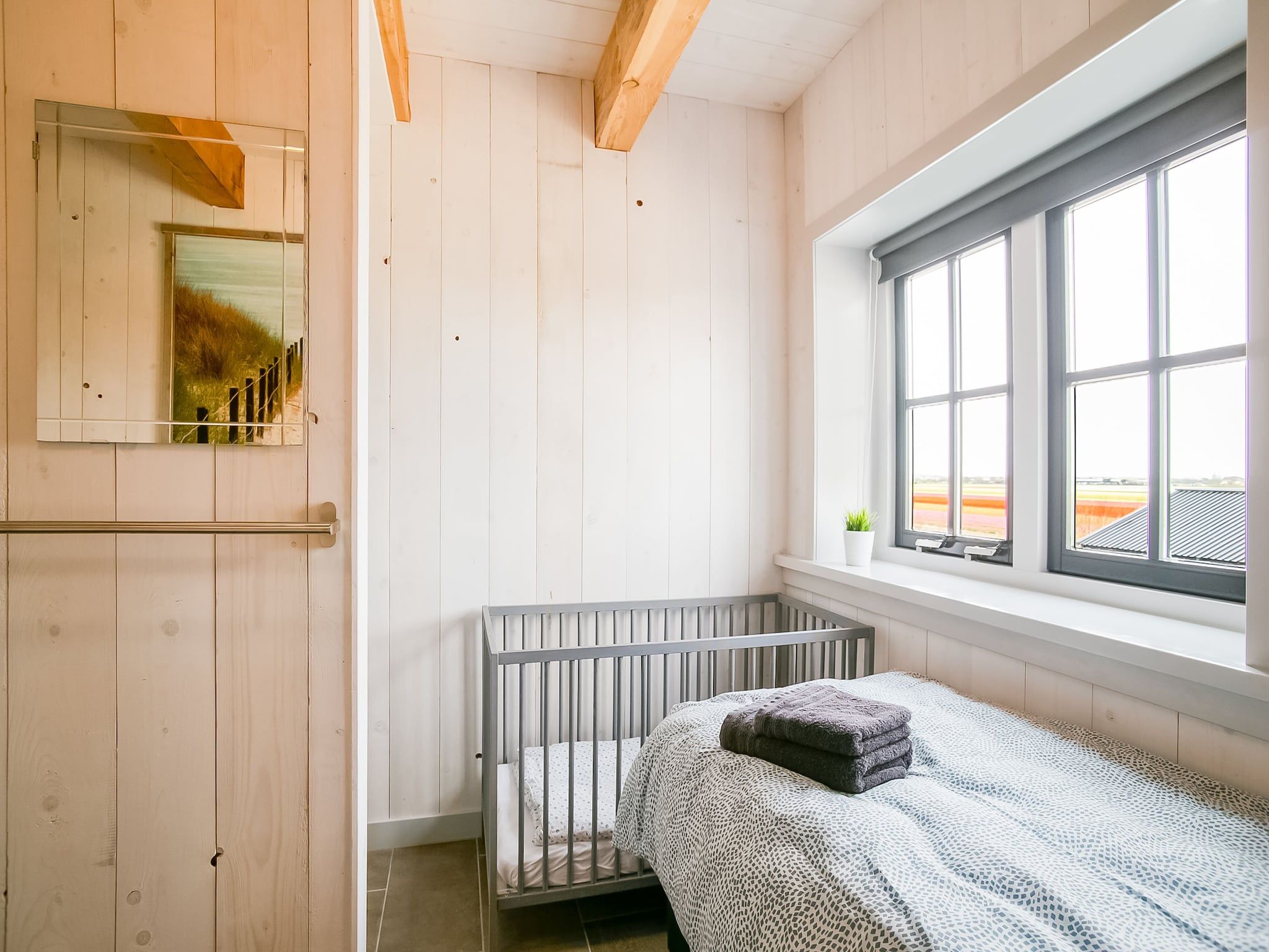 Een slaapkamer van Hazenborgh - Duinhuis 2 in Callantsoog