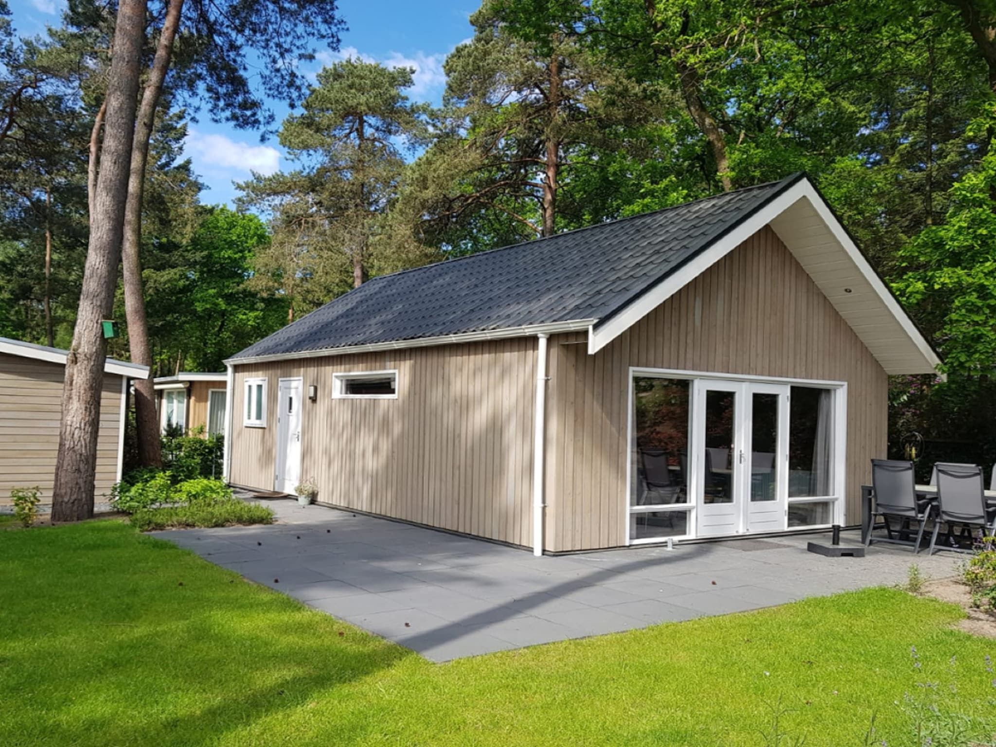 De buitenkant van Vakantiepark De Rimboe & De Woeste Hoogte 18 in Hoenderloo