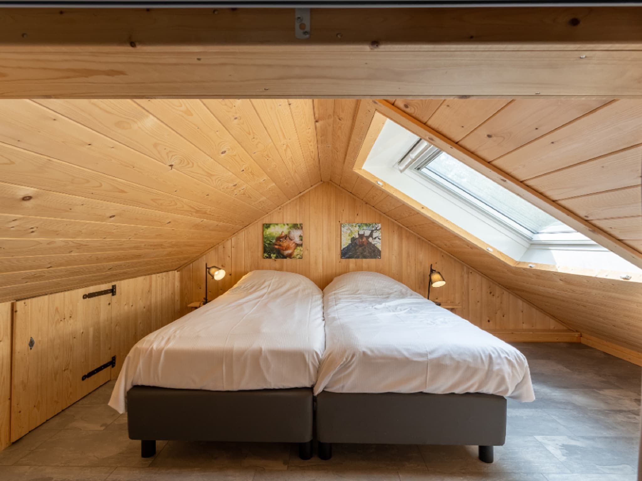 Een slaapkamer van Vakantiepark De Rimboe & De Woeste Hoogte 18 in Hoenderloo