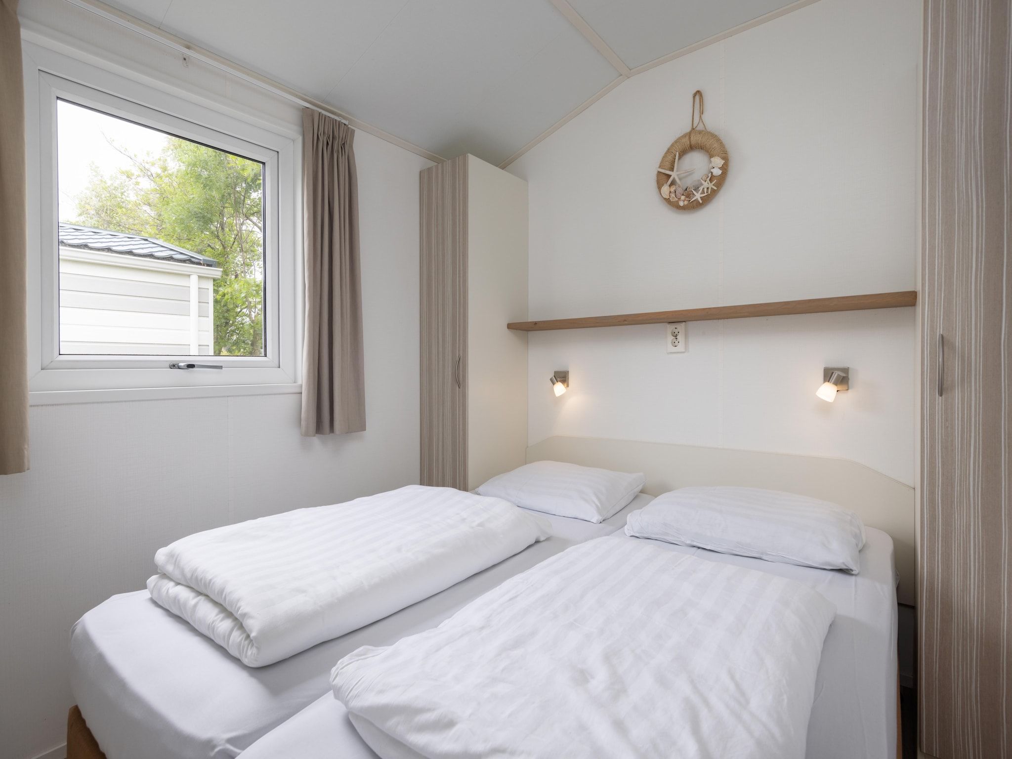 Een slaapkamer van Vakantiepark Callassande 4 in Callantsoog