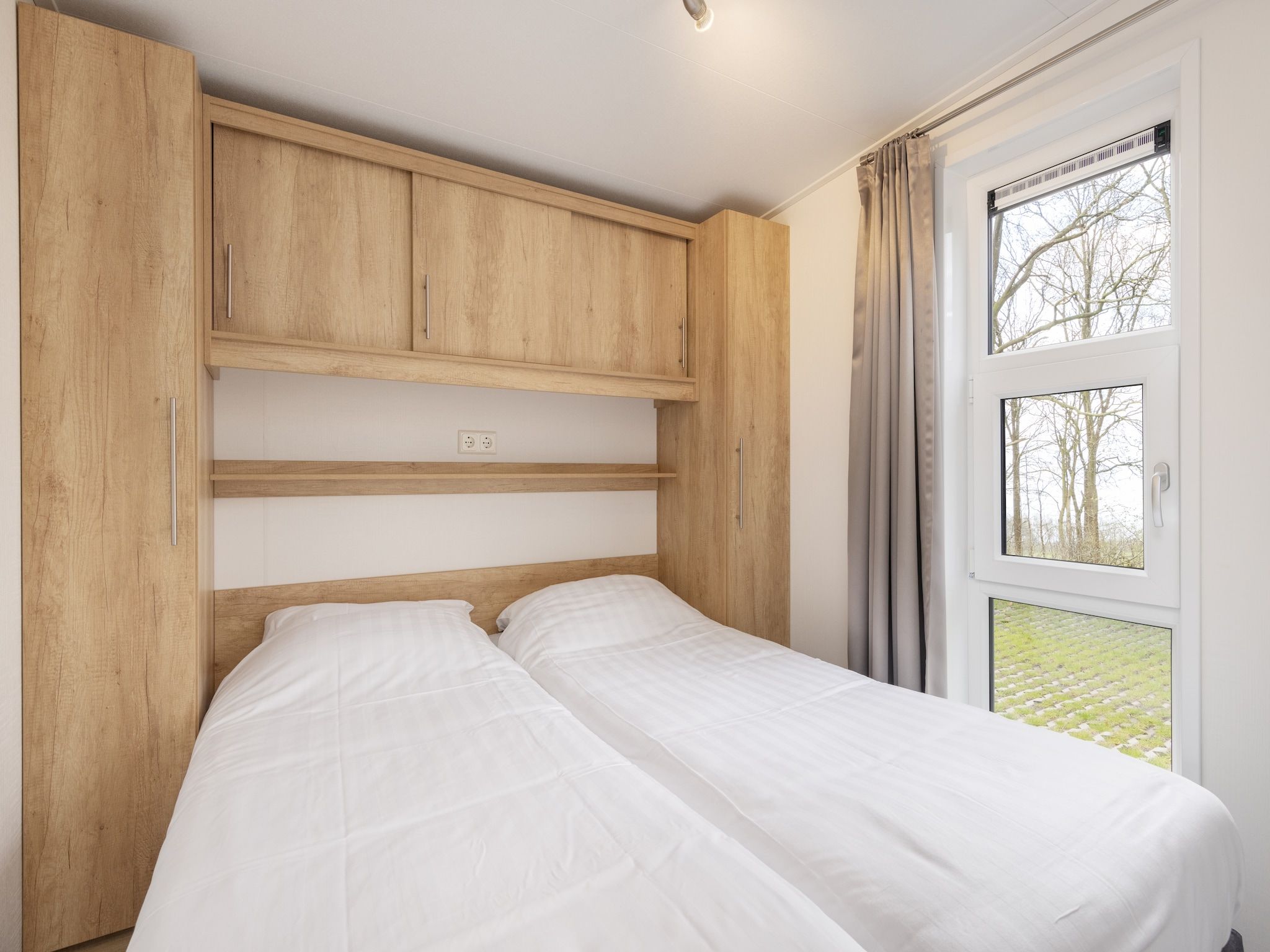 Een slaapkamer van Recreatiepark Tolplas 17 in Hoge Hexel