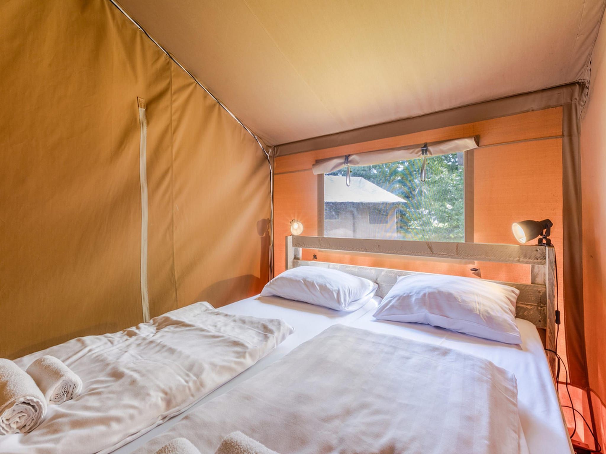 Een slaapkamer van Vakantiepark de Katjeskelder 19 in Oosterhout