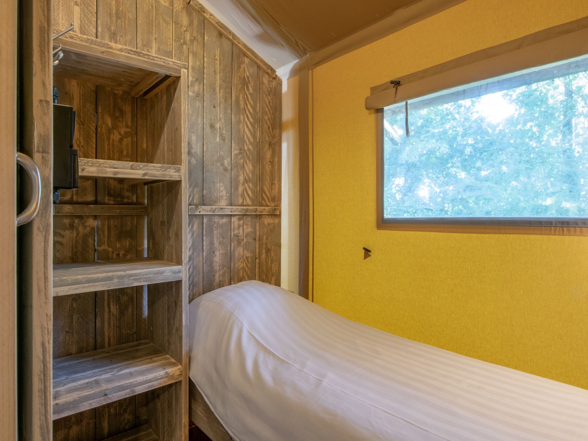 Een slaapkamer van Vakantiepark Klein Vink 21 in Arcen