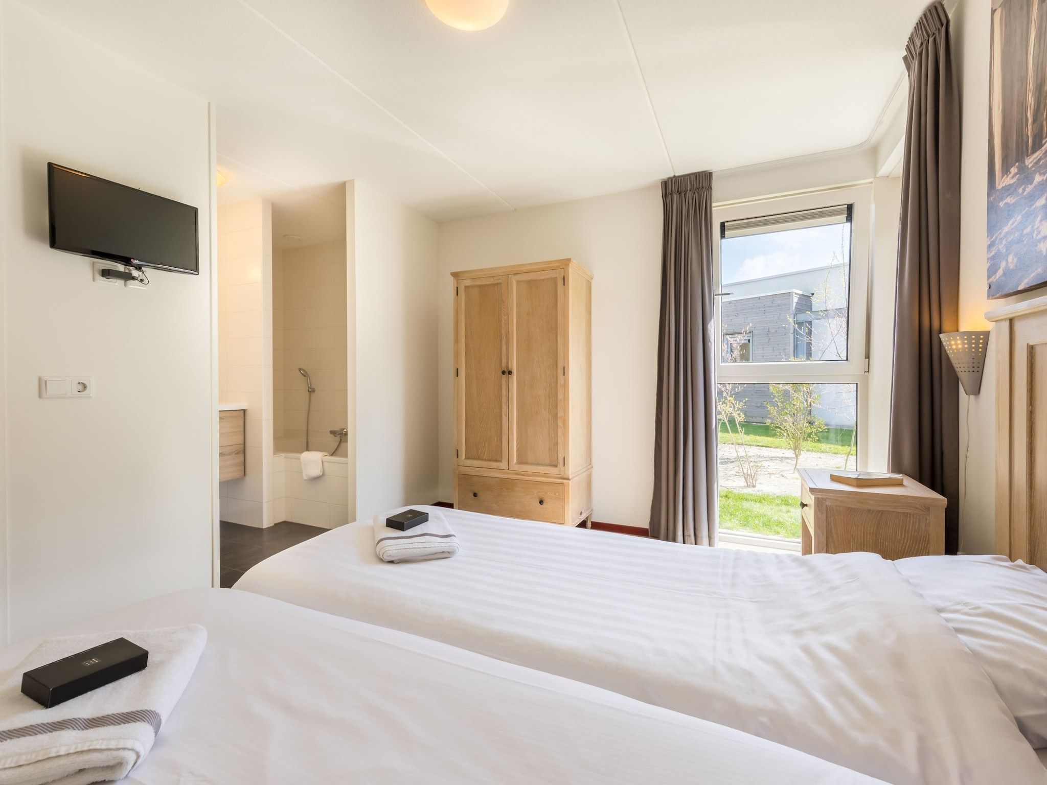 Een slaapkamer van Kustpark Texel 13 in De Koog