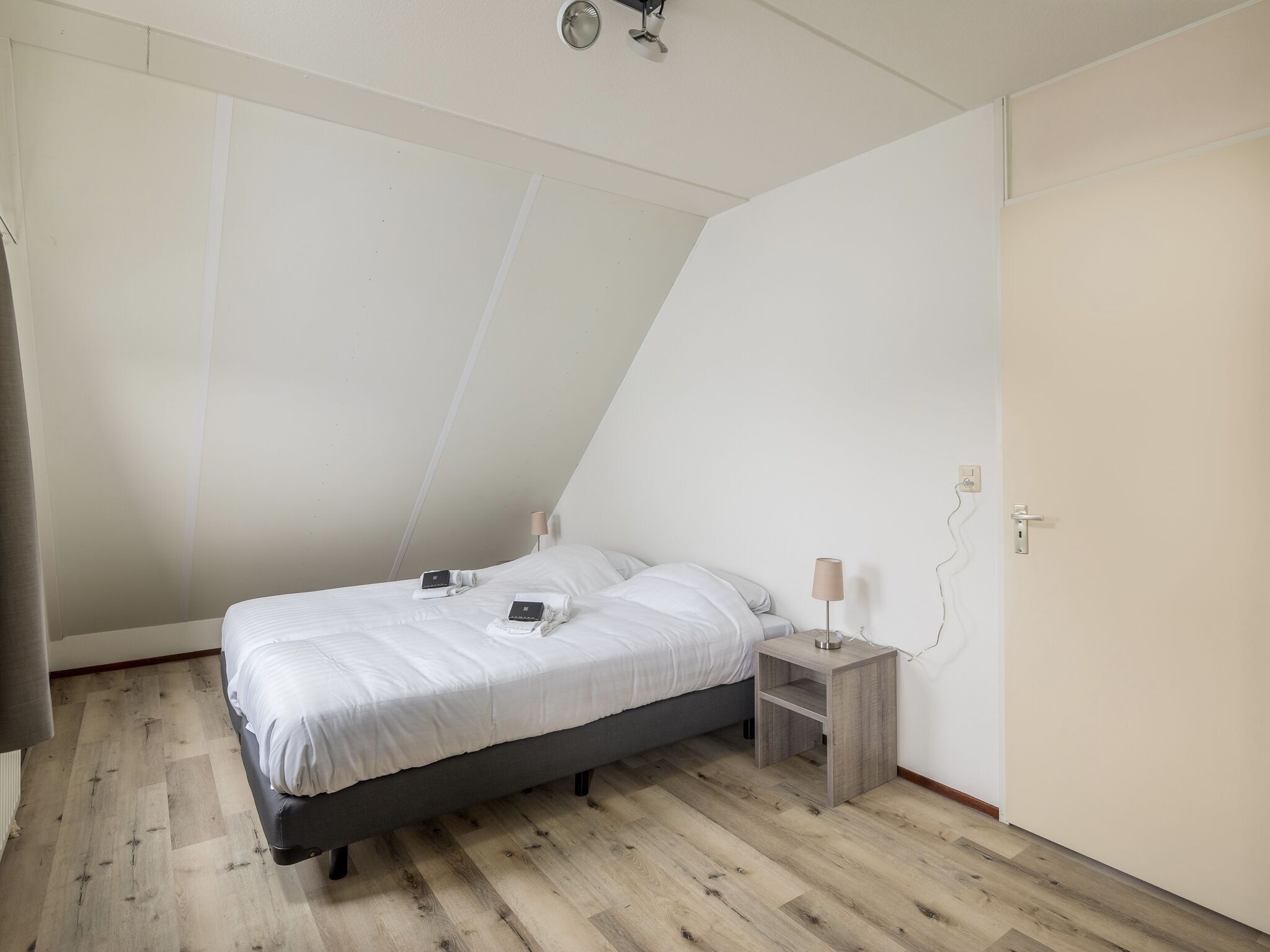 Een slaapkamer van Vakantiepark Zeeland Village 1 in Scharendijke