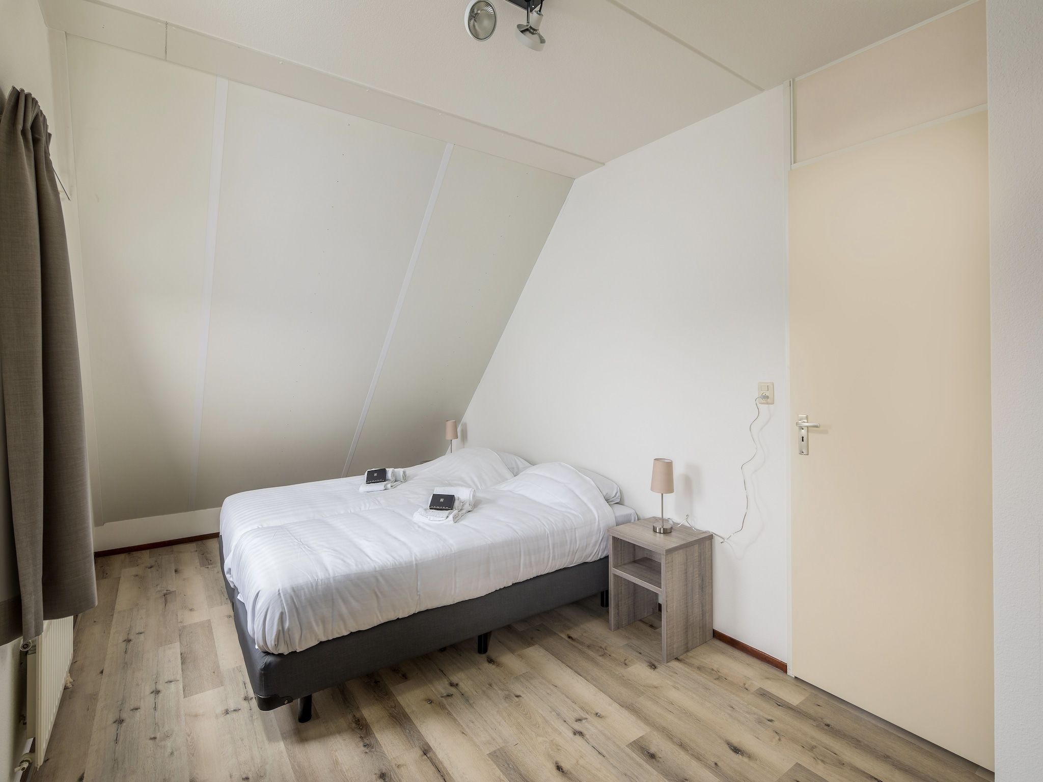 Een slaapkamer van Vakantiepark Zeeland Village 2 in Scharendijke