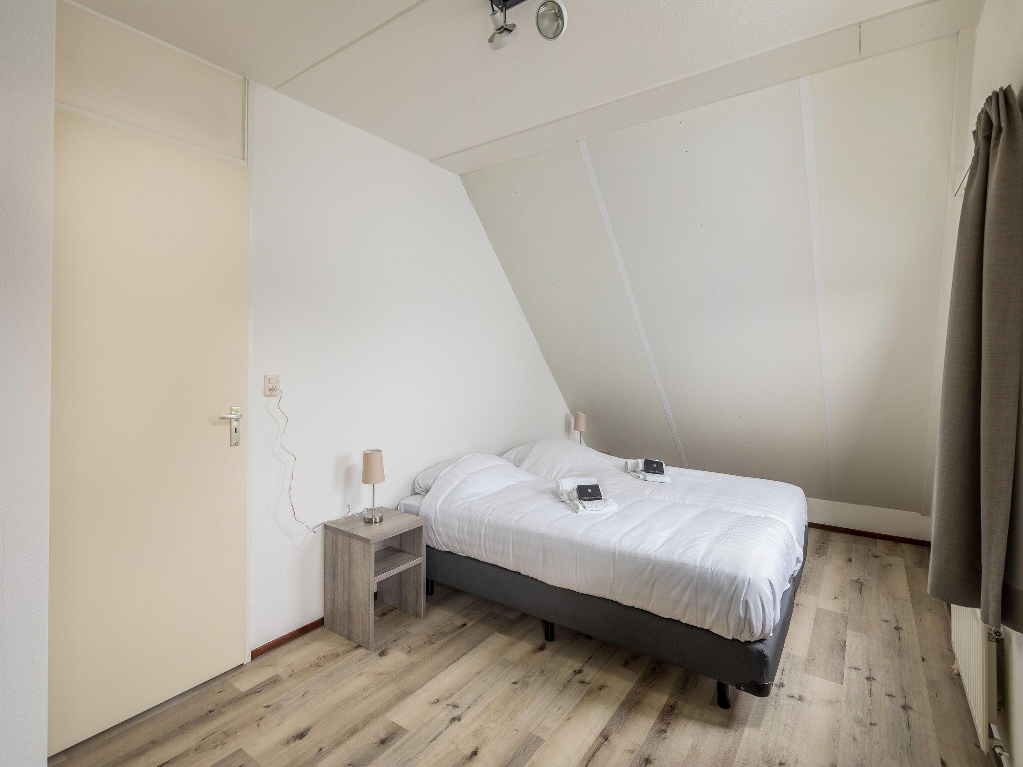 Een slaapkamer van Vakantiepark Zeeland Village 2 in Scharendijke