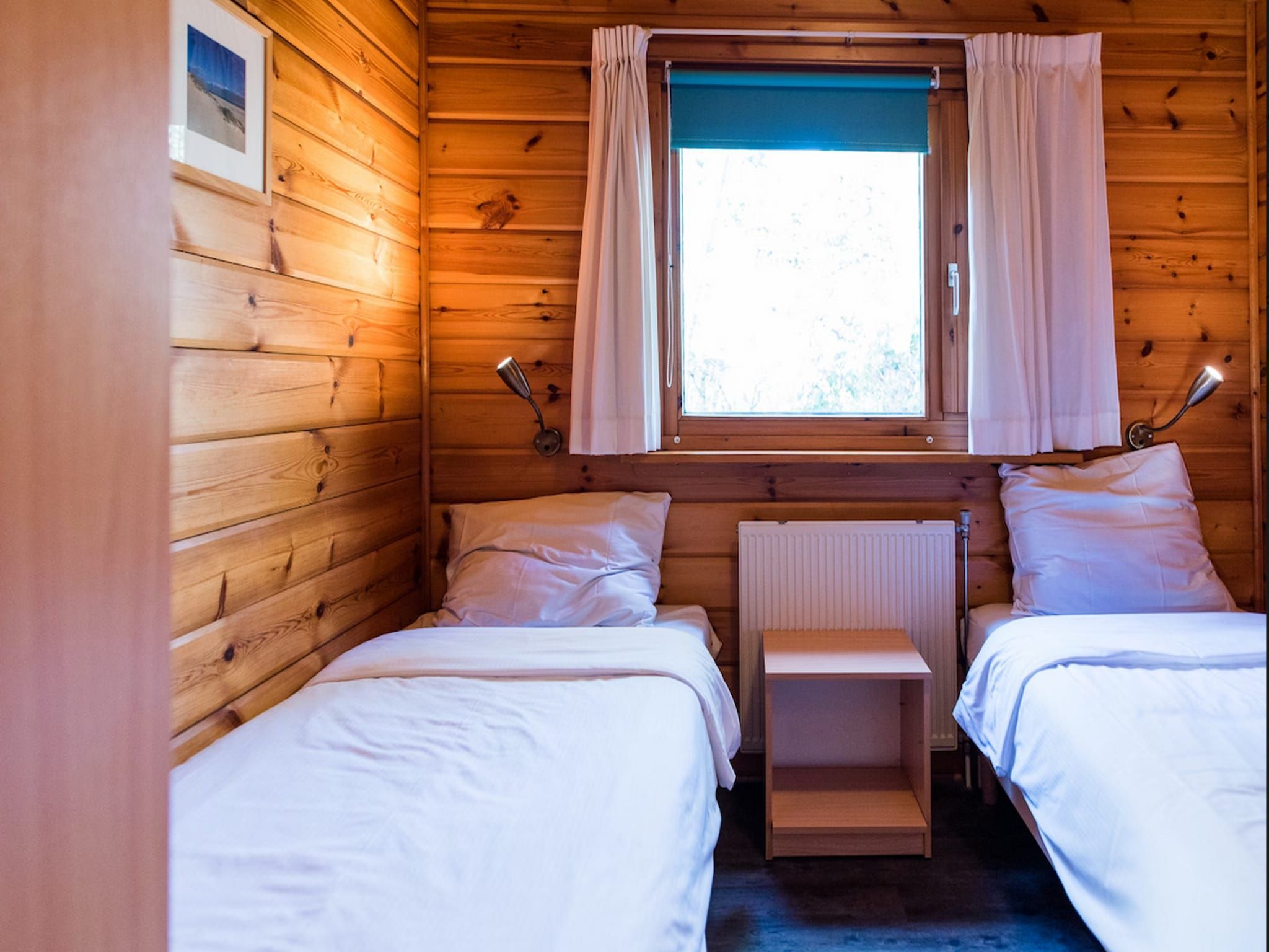 Een slaapkamer van Vakantiepark Boomhiemke 16 in Hollum