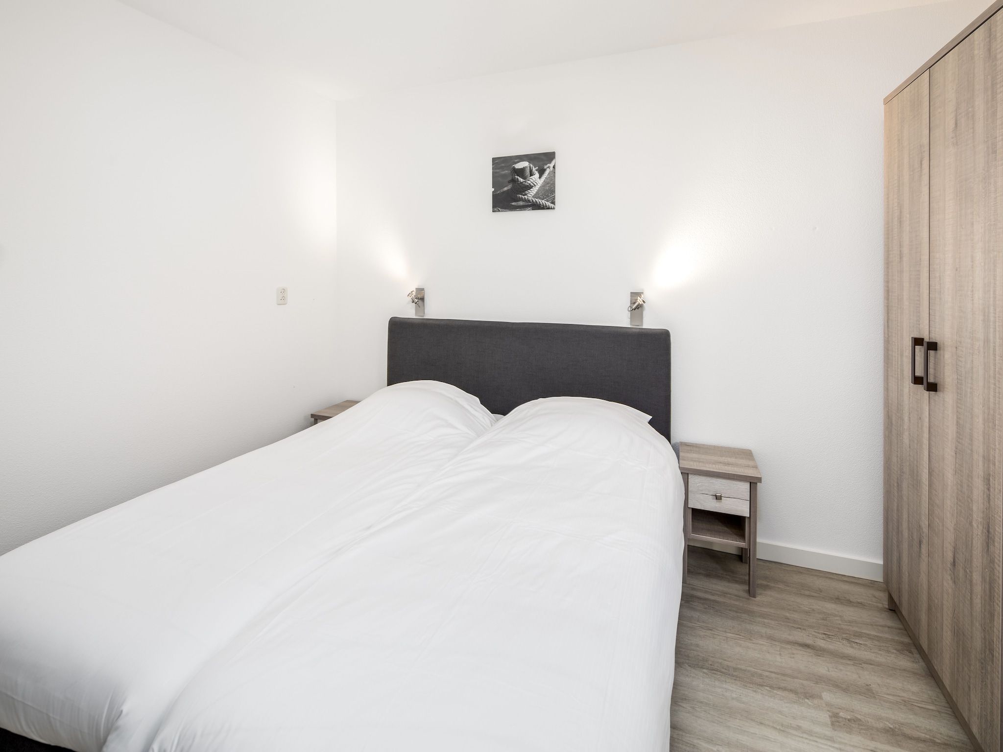 Een slaapkamer van Vakantiepark Bos en Duin 1 in Oostkapelle