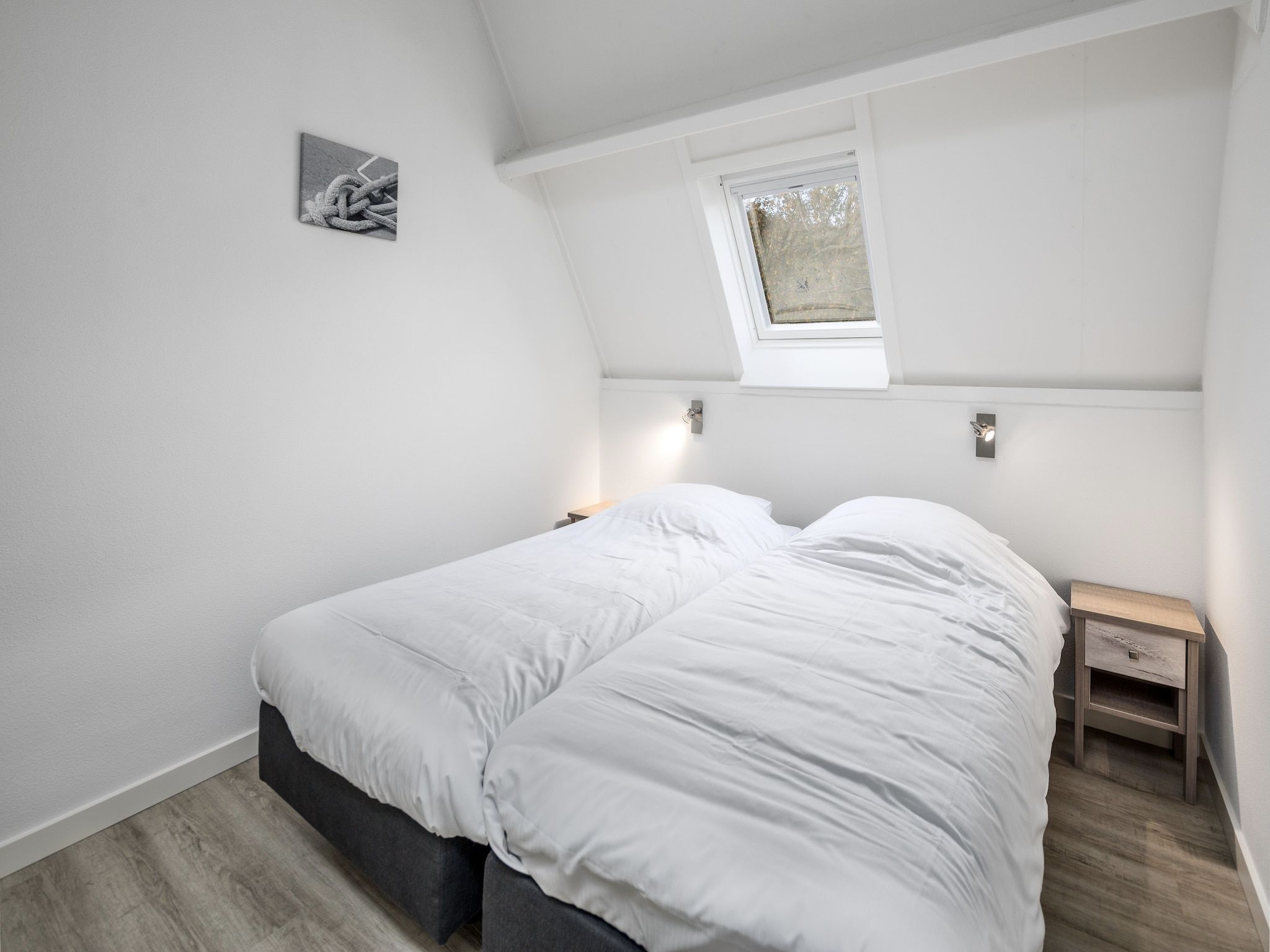 Een slaapkamer van Vakantiepark Bos en Duin 1 in Oostkapelle