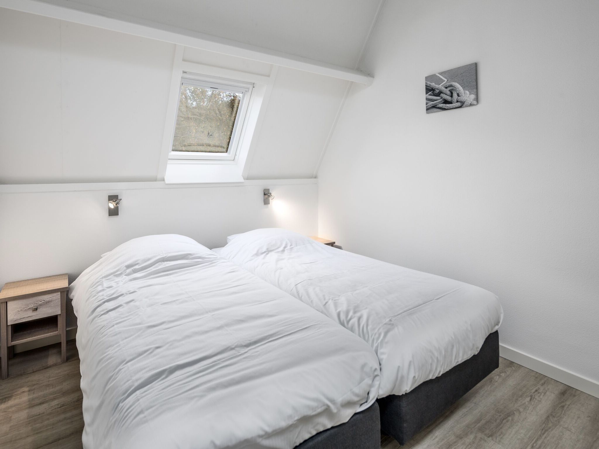 Een slaapkamer van Vakantiepark Bos en Duin 1 in Oostkapelle