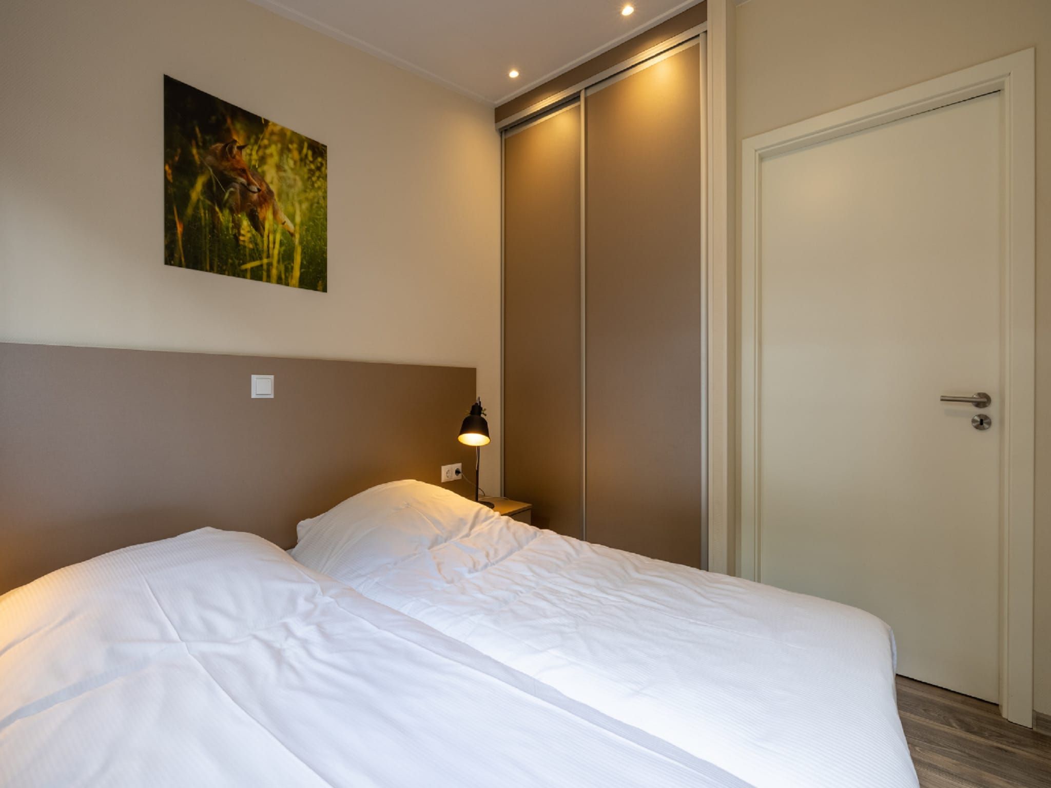 Een slaapkamer van Vakantiepark De Rimboe & De Woeste Hoogte 20 in Hoenderloo