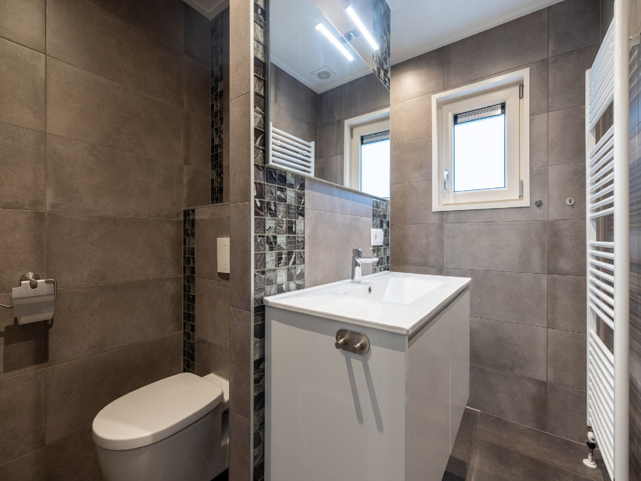 De badkamer van Vakantiepark De Rimboe & De Woeste Hoogte 20 in Hoenderloo