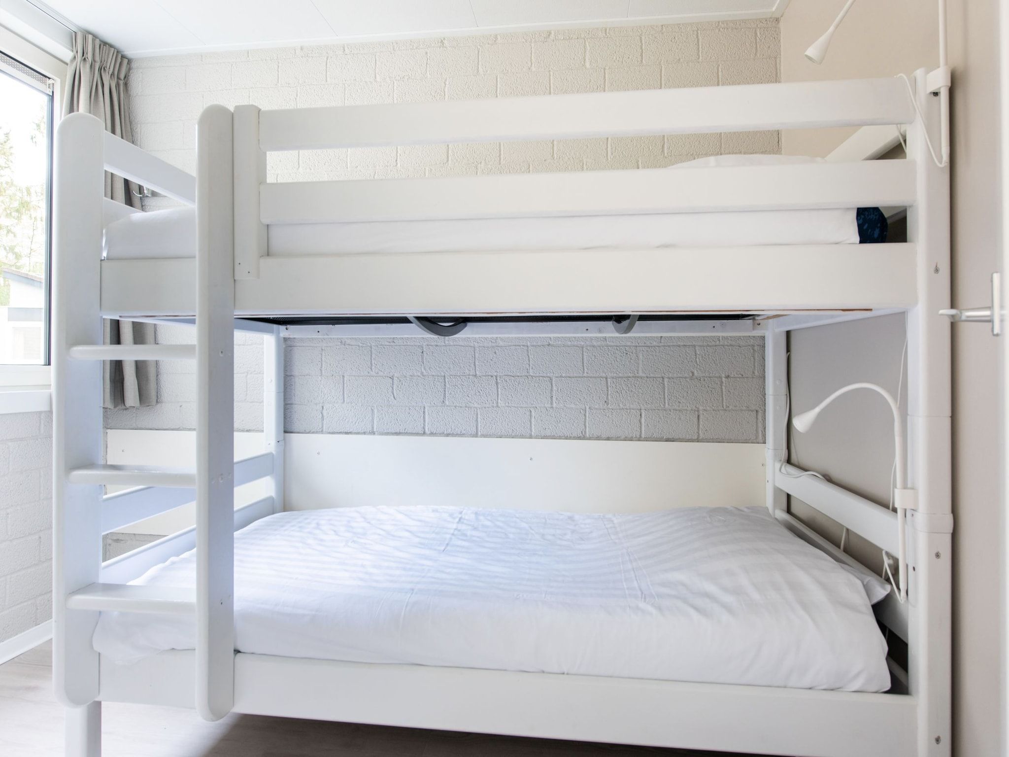 Een slaapkamer van Vakantiepark de Berkenhorst 10 in Kootwijk