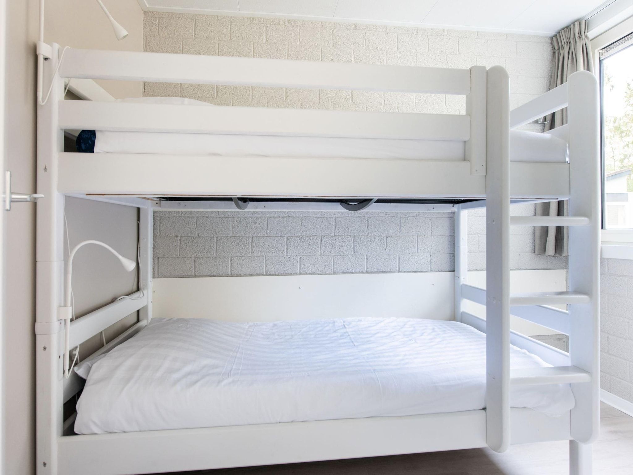 Een slaapkamer van Vakantiepark de Berkenhorst 10 in Kootwijk