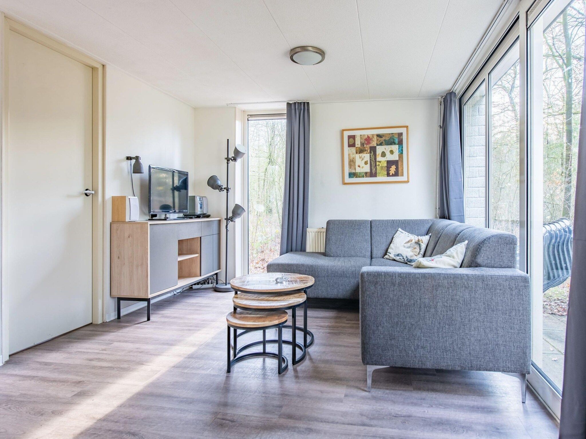 De woonkamer van Vakantiepark de Berkenhorst 11 in Kootwijk